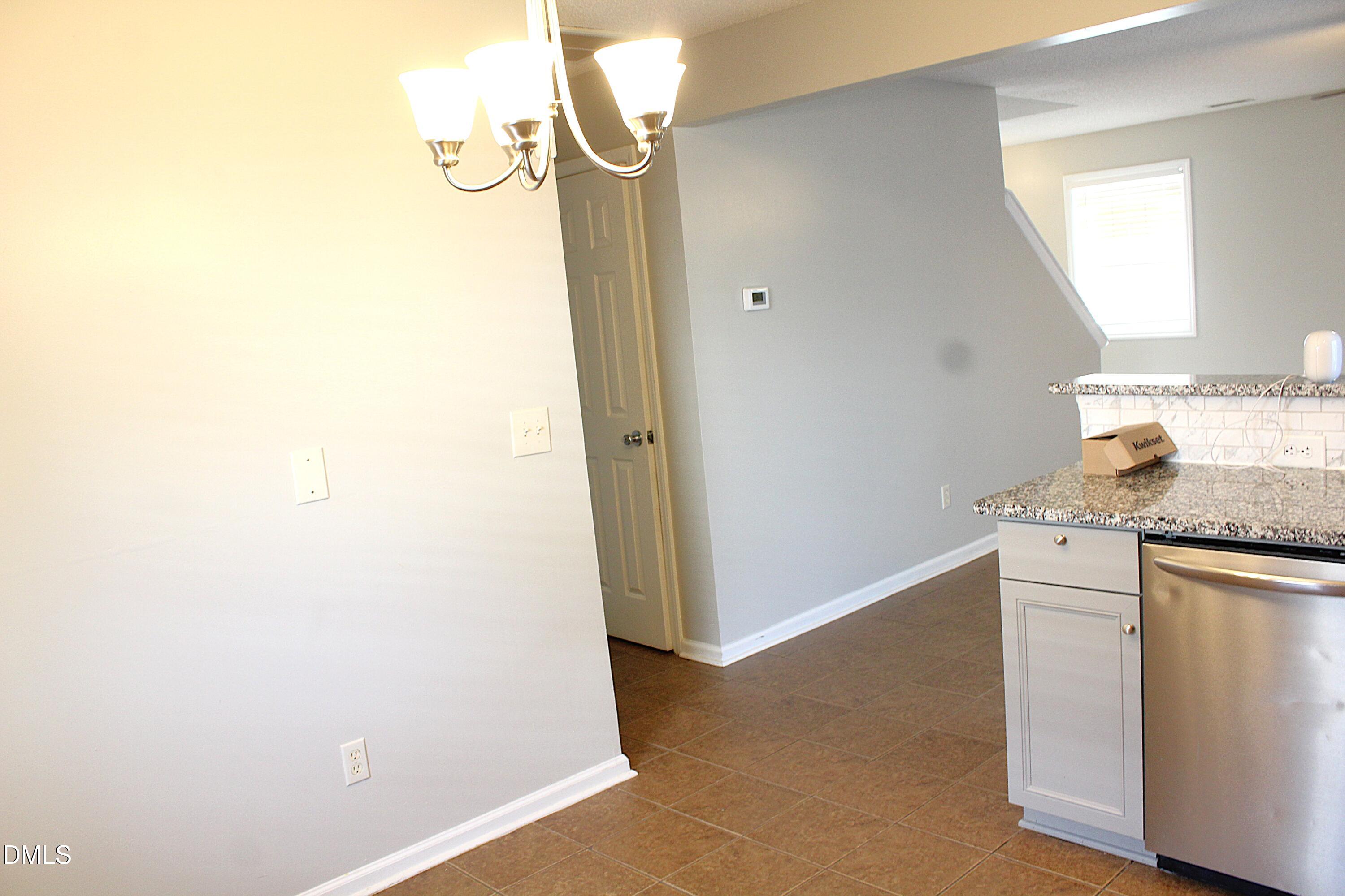 4305 Standing Rock Way Raleigh, NC 27604 - Photo 3 of 11 a view of a kitchen cabinets a sink and a window