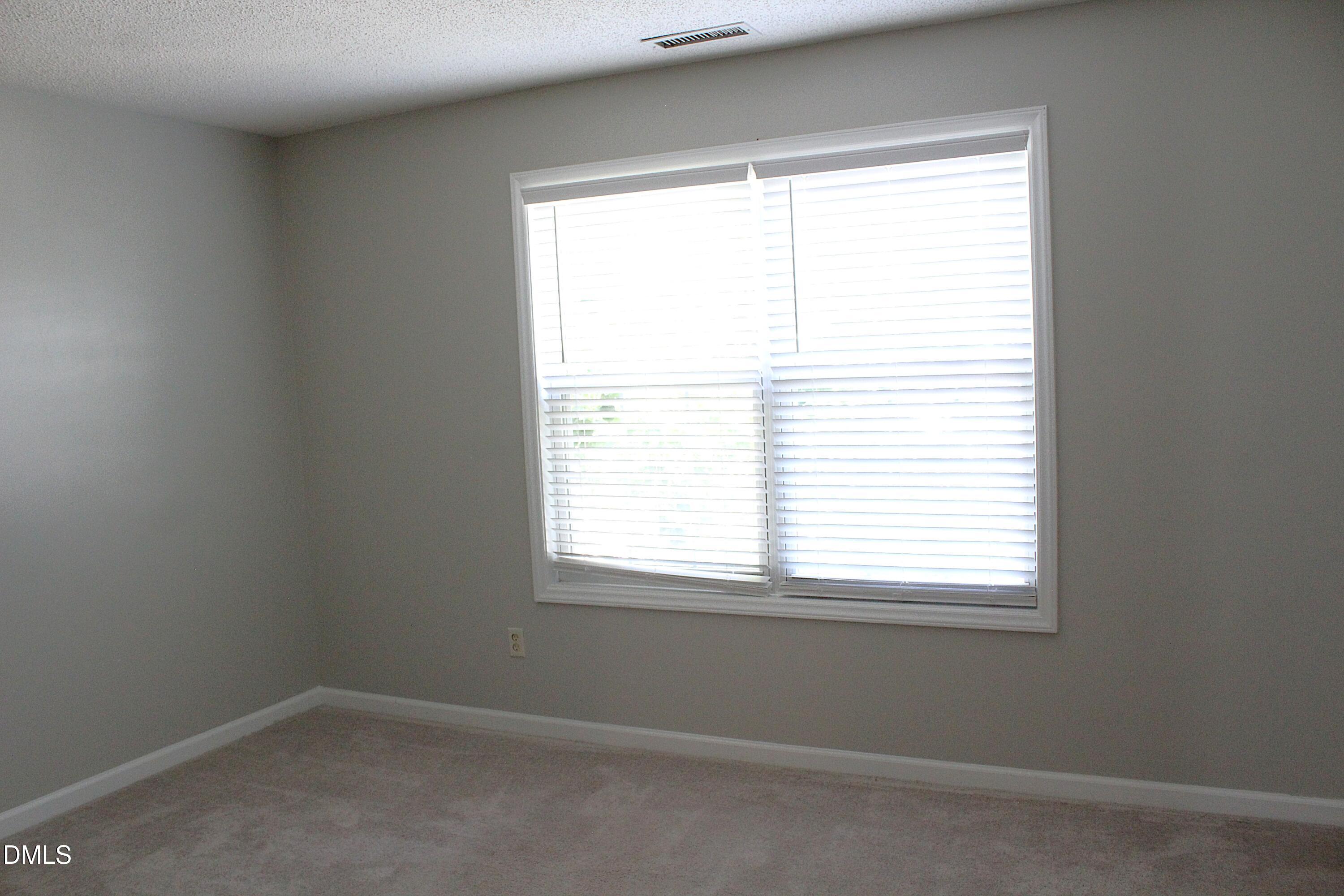 4305 Standing Rock Way Raleigh, NC 27604 - Photo 7 of 11 an empty room with a window