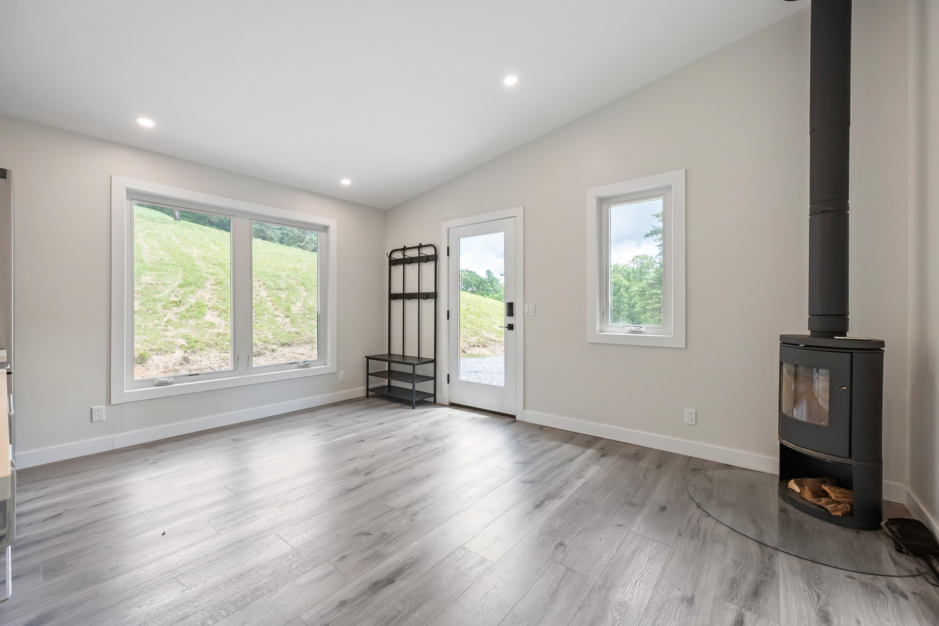133 Wonder Way Northeast Pilot, VA 24138 - Photo 11 of 57 an empty room with wooden floor and windows