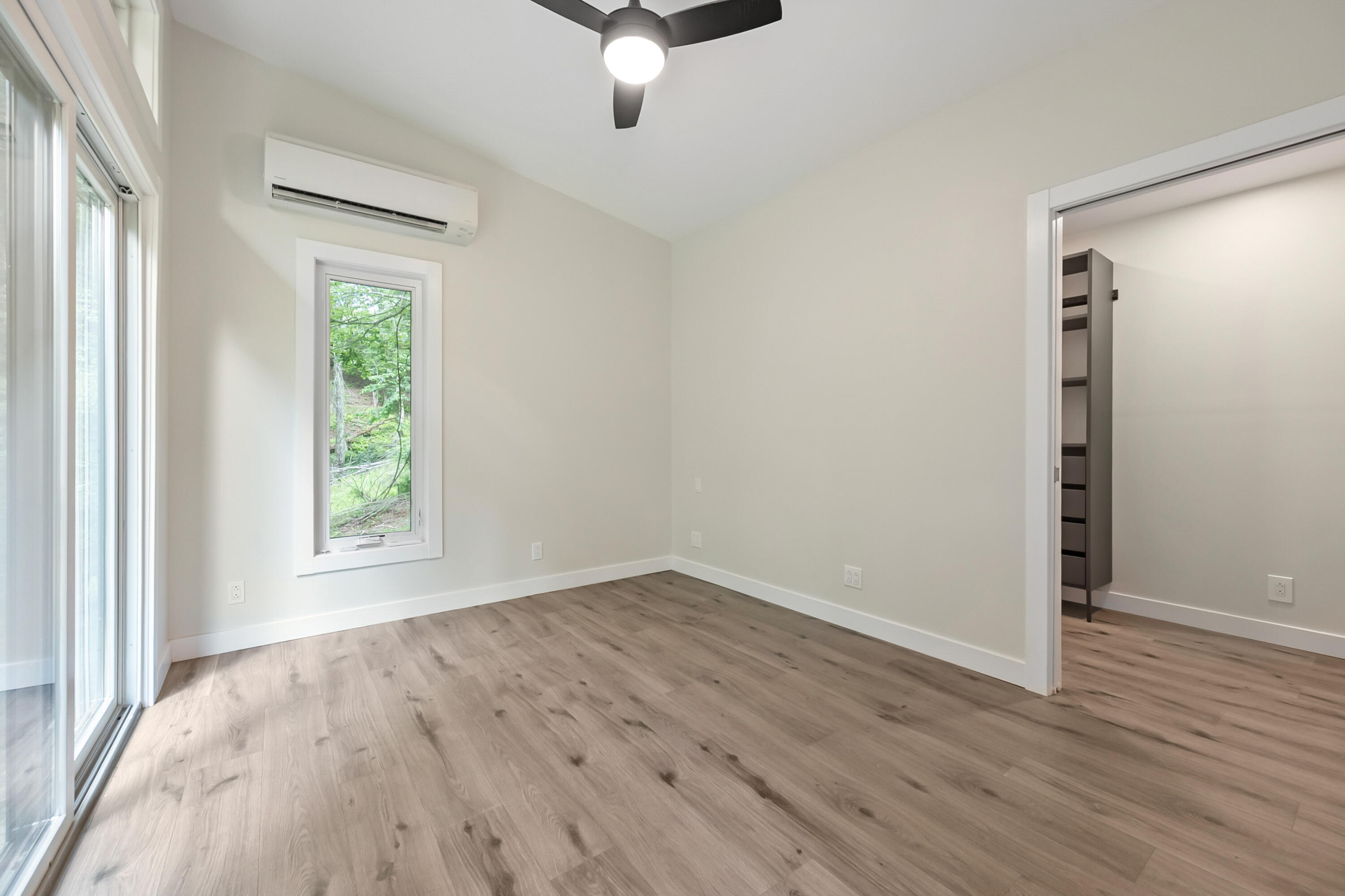133 Wonder Way Northeast Pilot, VA 24138 - Photo 13 of 57 an empty room with wooden floor cabinet and windows