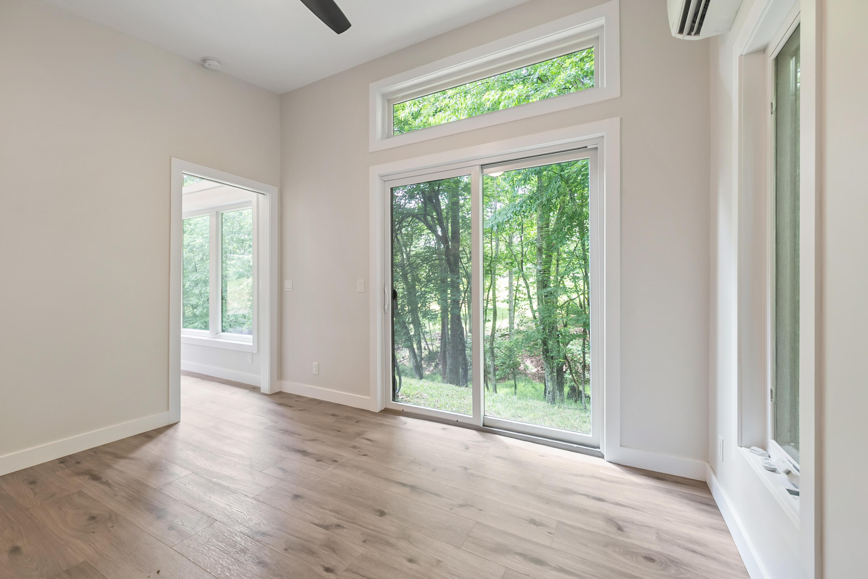 133 Wonder Way Northeast Pilot, VA 24138 - Photo 16 of 57 a view of an empty room with wooden floor and a window