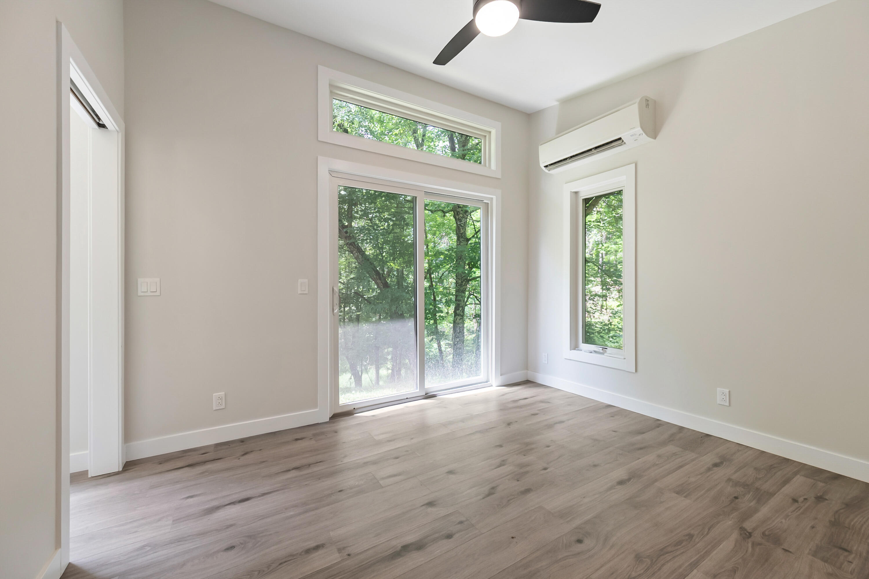 133 Wonder Way Northeast Pilot, VA 24138 - Photo 17 of 57 an empty room with wooden floor and windows