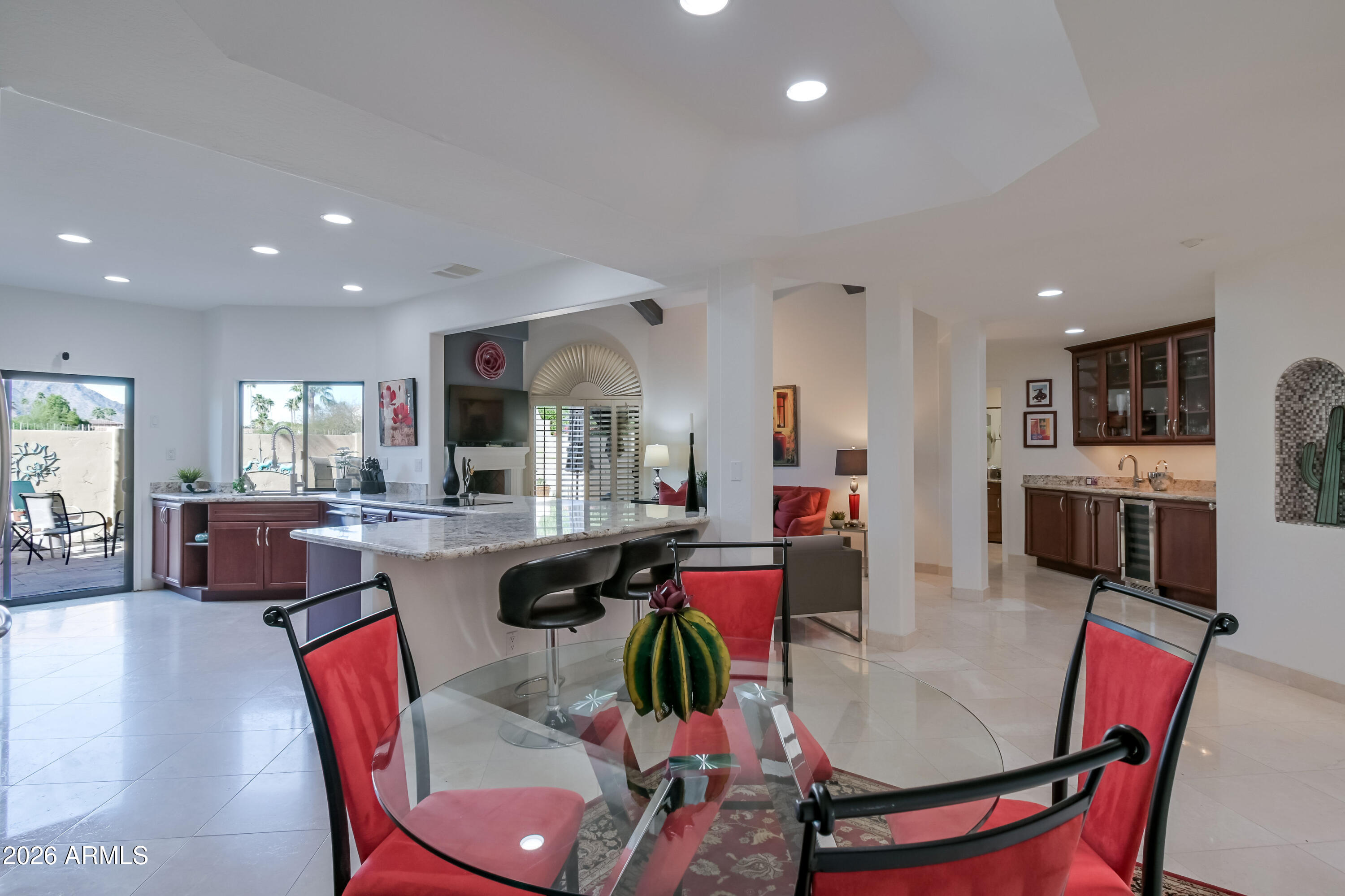 7955 East Chaparral Road, Unit 62 Scottsdale, AZ 85250 - Photo 13 of 38 a living room with furniture kitchen and a table
