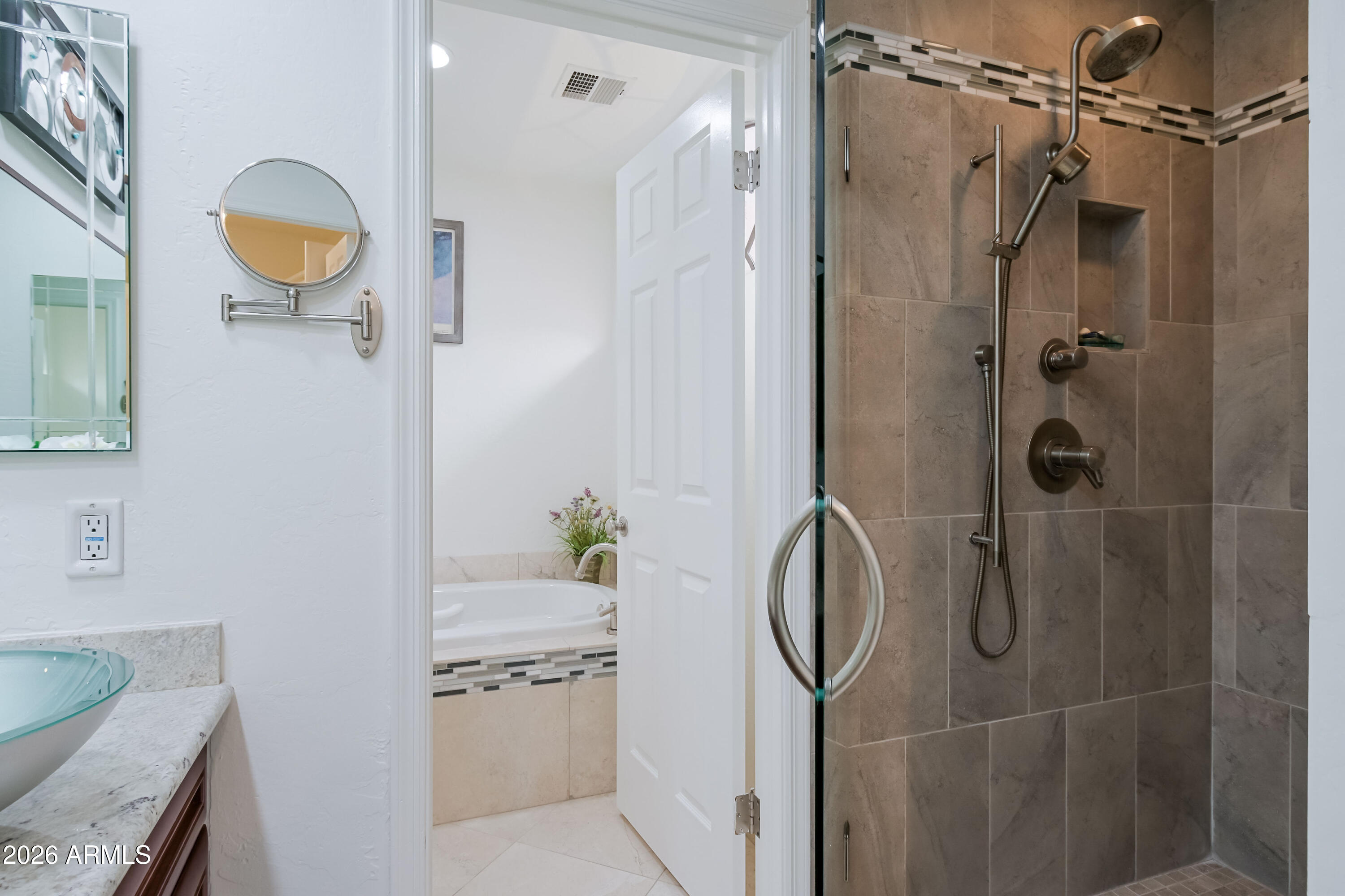 7955 East Chaparral Road, Unit 62 Scottsdale, AZ 85250 - Photo 16 of 38 a bathroom with a granite countertop shower and a sink