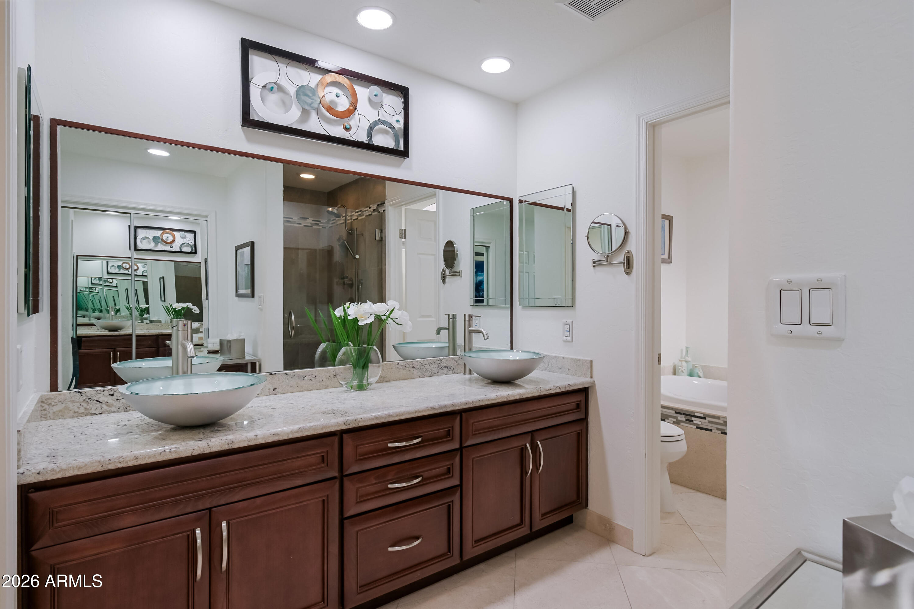 7955 East Chaparral Road, Unit 62 Scottsdale, AZ 85250 - Photo 18 of 38 a spacious bathroom with a granite countertop sink and a mirror