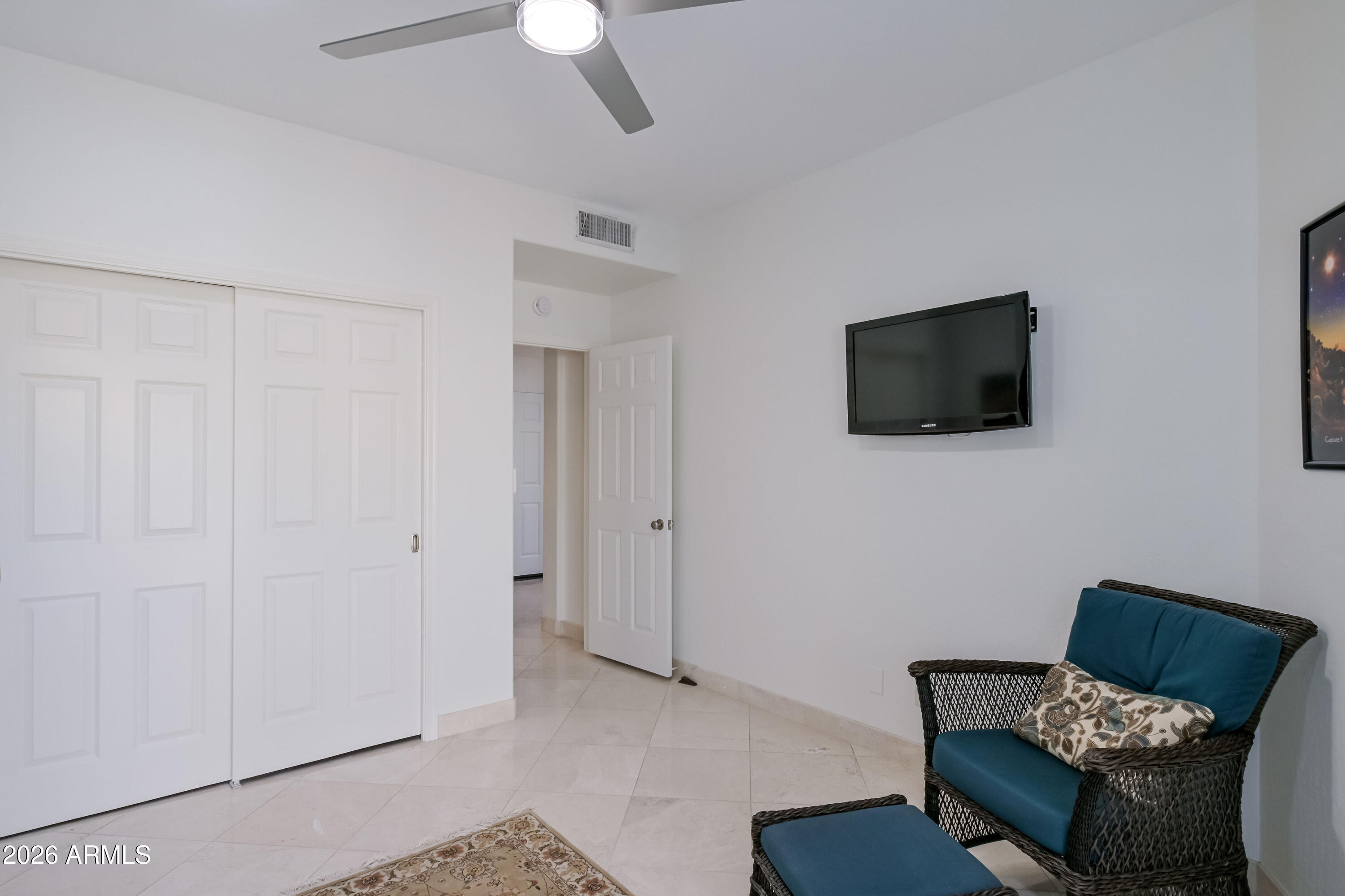 7955 East Chaparral Road, Unit 62 Scottsdale, AZ 85250 - Photo 19 of 38 a living room with furniture and a flat screen tv