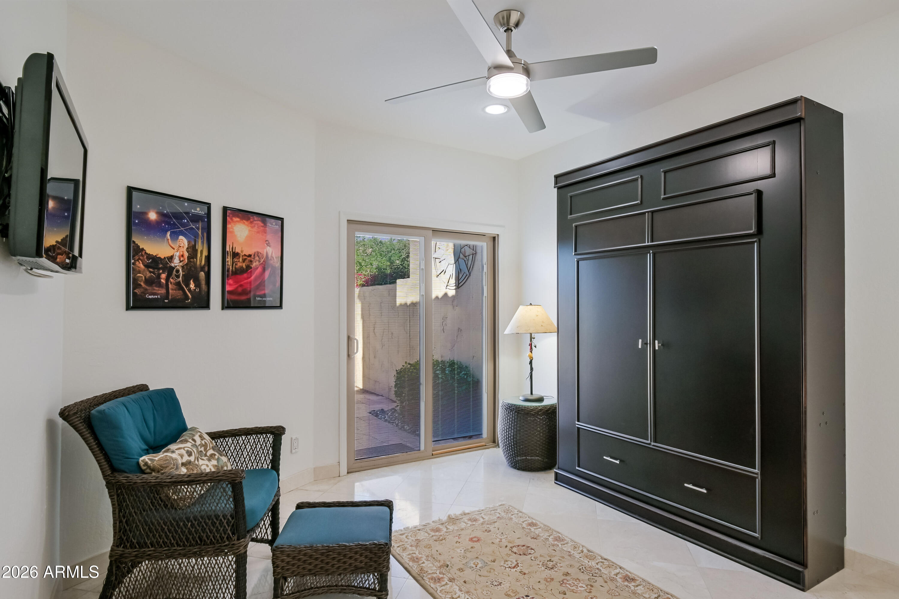 7955 East Chaparral Road, Unit 62 Scottsdale, AZ 85250 - Photo 20 of 38 a living room with furniture and a flat screen tv