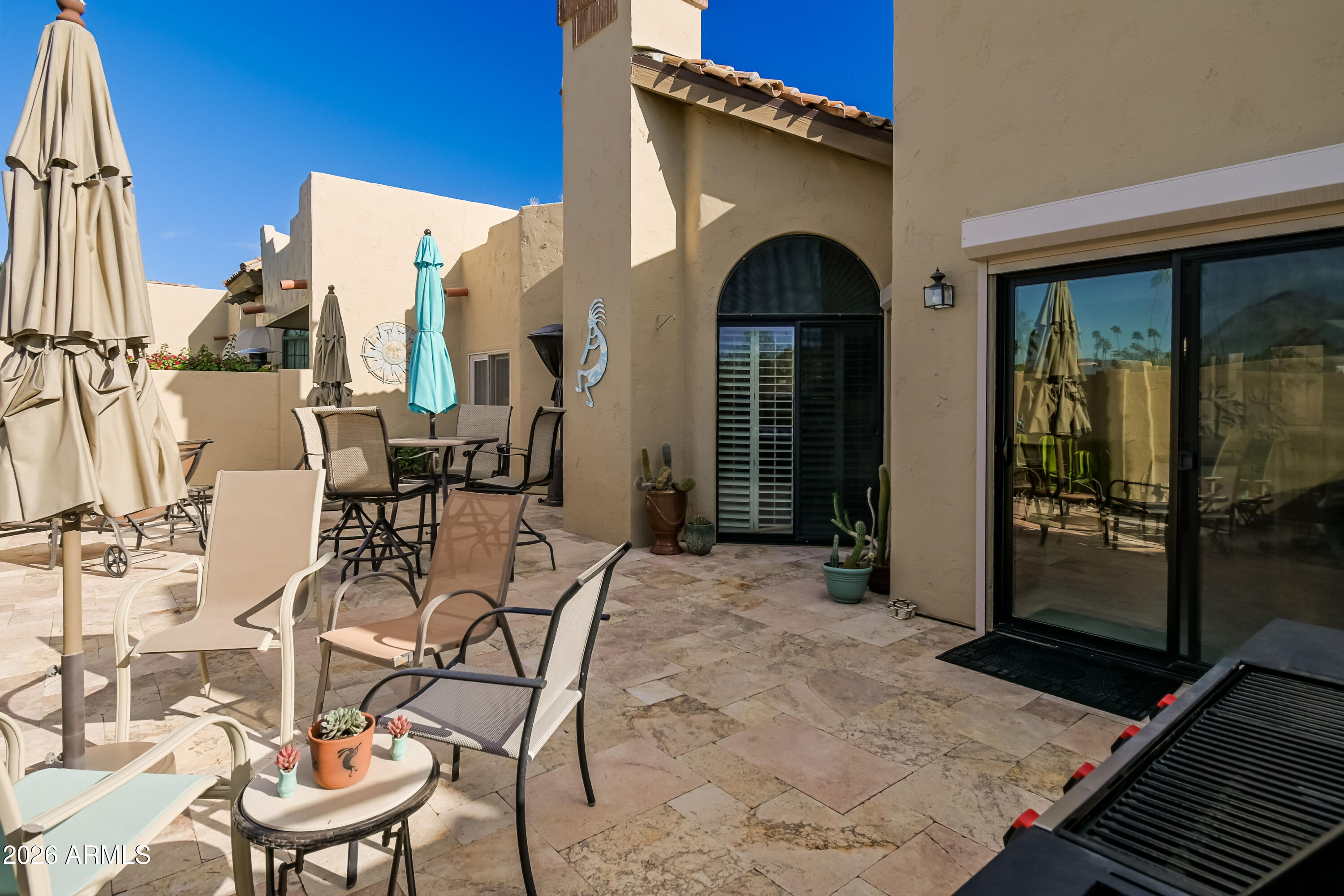 7955 East Chaparral Road, Unit 62 Scottsdale, AZ 85250 - Photo 24 of 38 a view of a balcony with furniture and large window