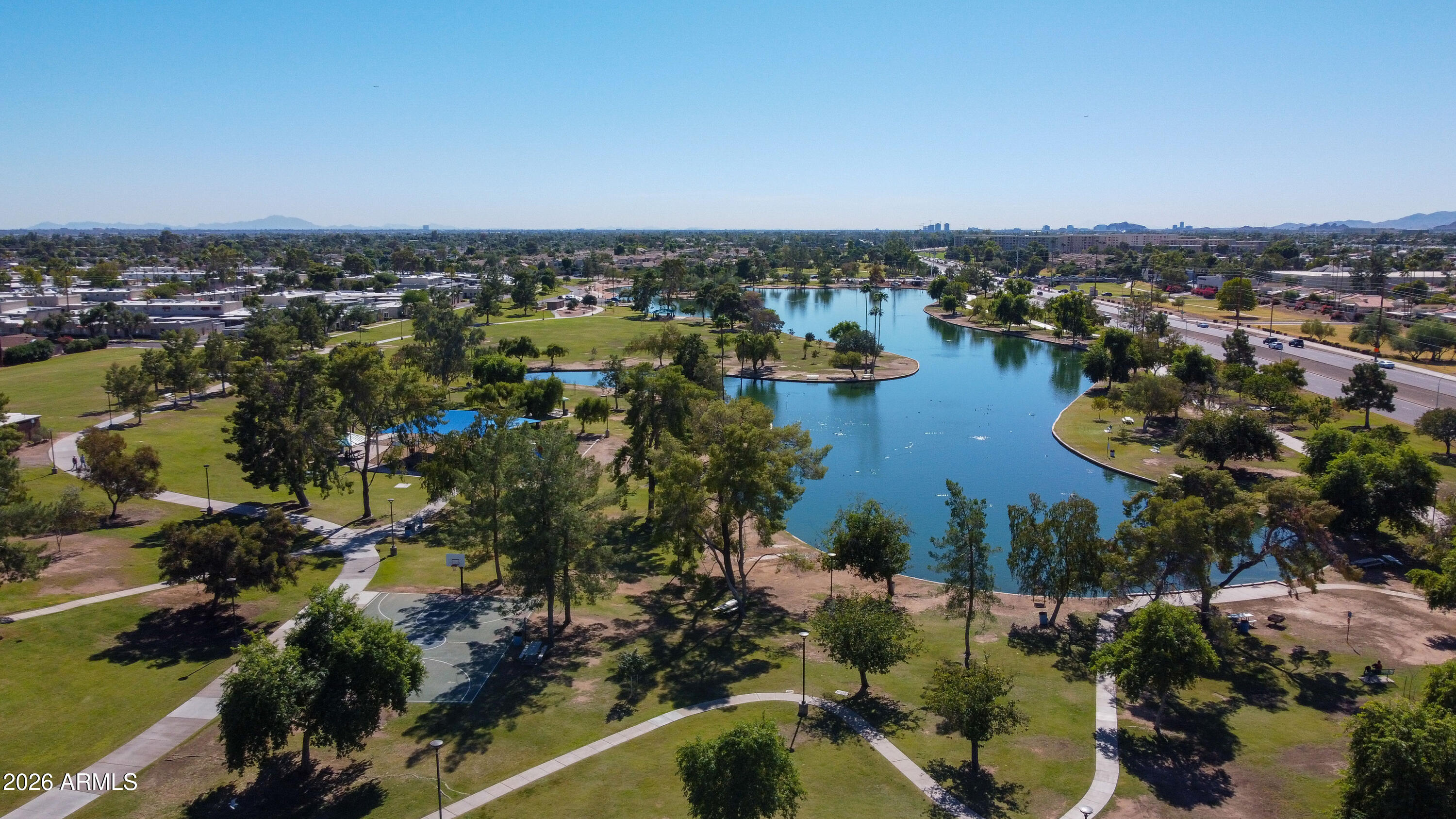 7955 East Chaparral Road, Unit 62 Scottsdale, AZ 85250 - Photo 34 of 38 a view of a lake with a city