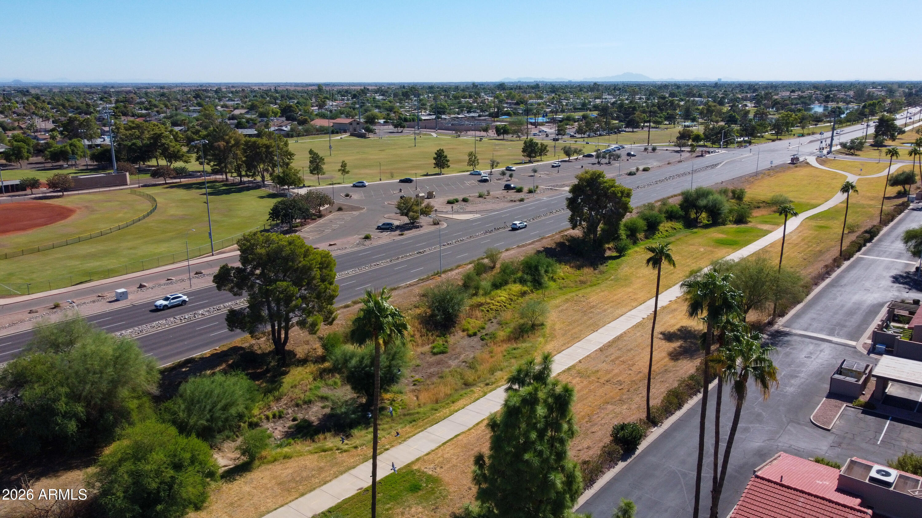 7955 East Chaparral Road, Unit 62 Scottsdale, AZ 85250 - Photo 37 of 38 an aerial view of a city with lots of residential buildings ocean and mountain view in back