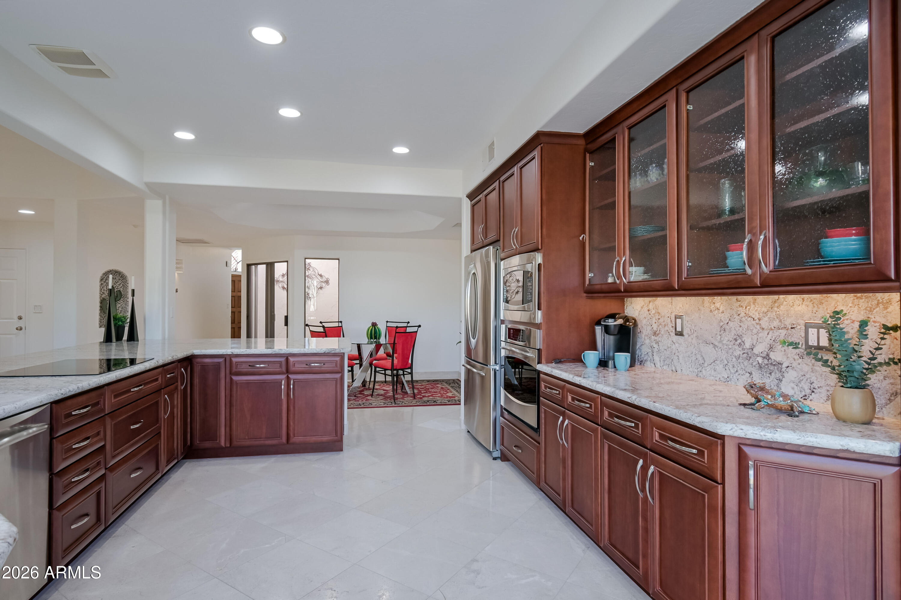 7955 East Chaparral Road, Unit 62 Scottsdale, AZ 85250 - Photo 5 of 38 a kitchen with stainless steel appliances sink cabinets and window