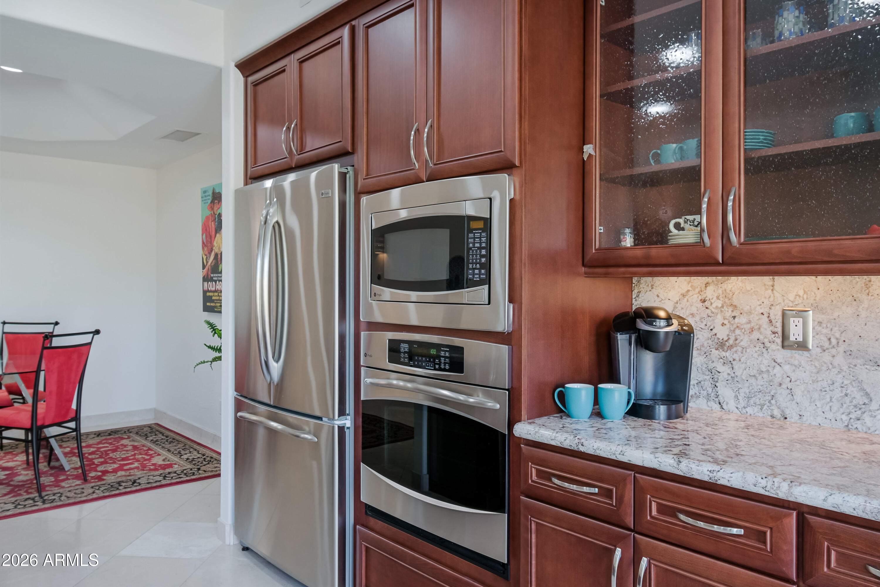 7955 East Chaparral Road, Unit 62 Scottsdale, AZ 85250 - Photo 10 of 38 a kitchen with granite countertop a refrigerator stove and microwave