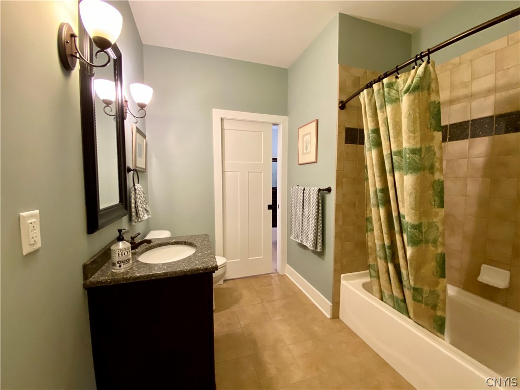 4981 Astilbe Path Clay, NY 13088 - Photo 29 of 48 Nifty pocket door into ceramic guest bath.