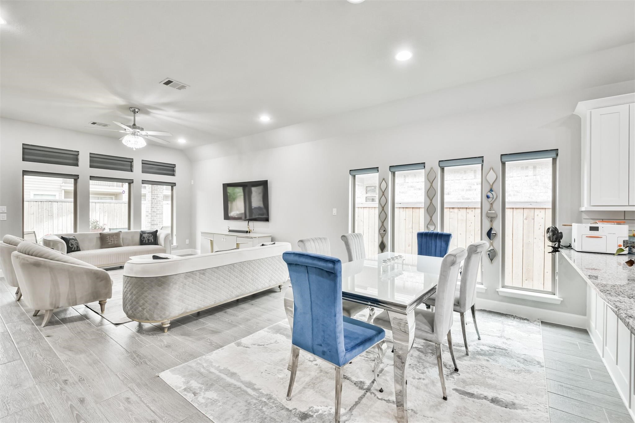 15018 Concho River Way Cypress, TX 77433 - Photo 11 of 34 a view of a dining room with furniture window and wooden floor
