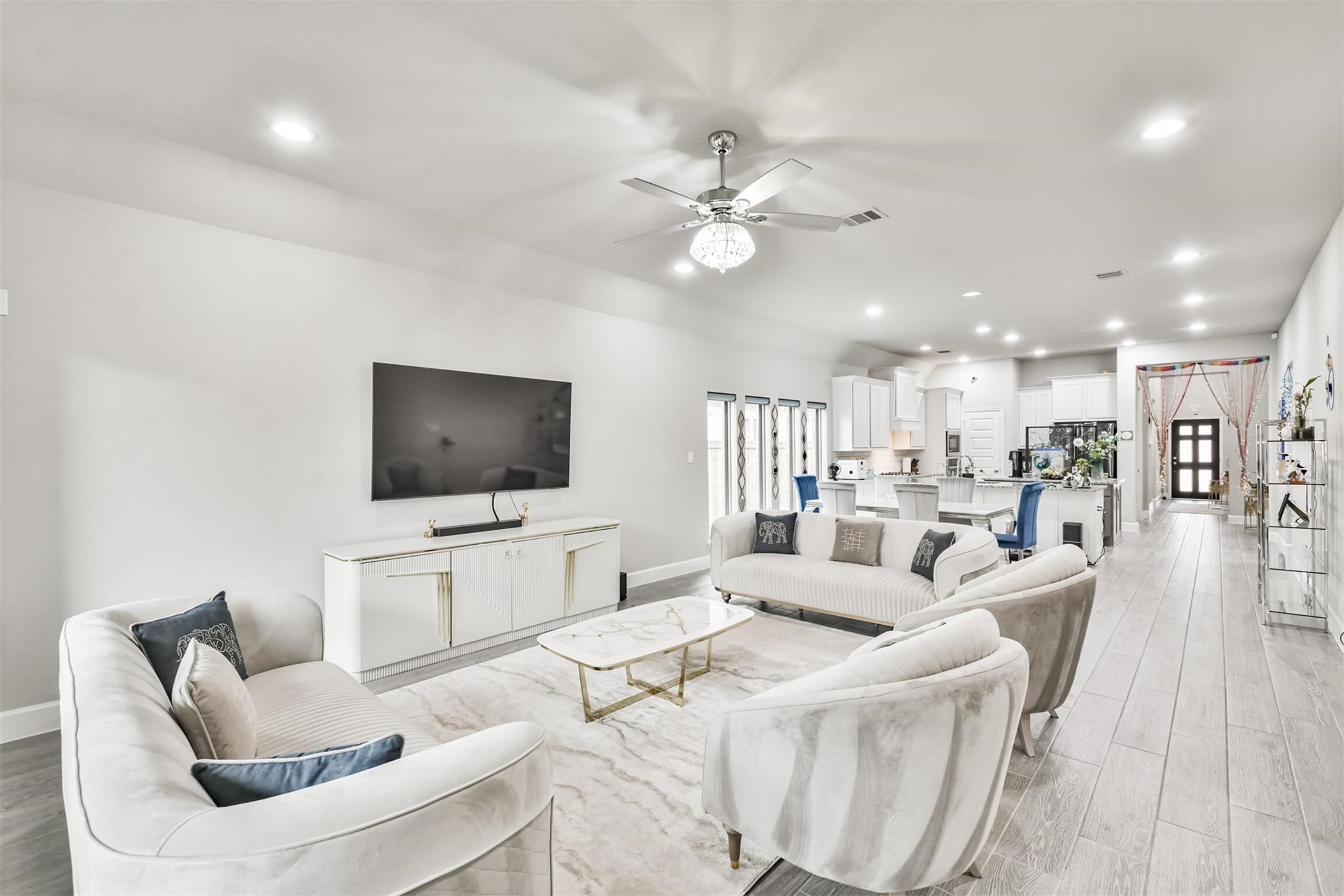 15018 Concho River Way Cypress, TX 77433 - Photo 14 of 34 a living room with furniture and a flat screen tv