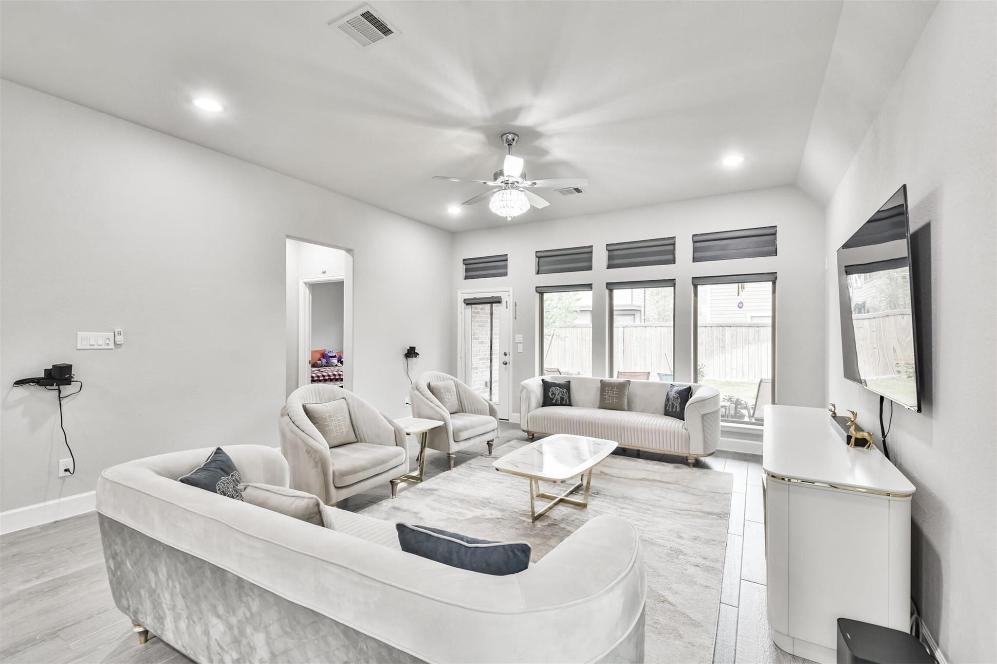 15018 Concho River Way Cypress, TX 77433 - Photo 15 of 34 a living room with furniture and large windows