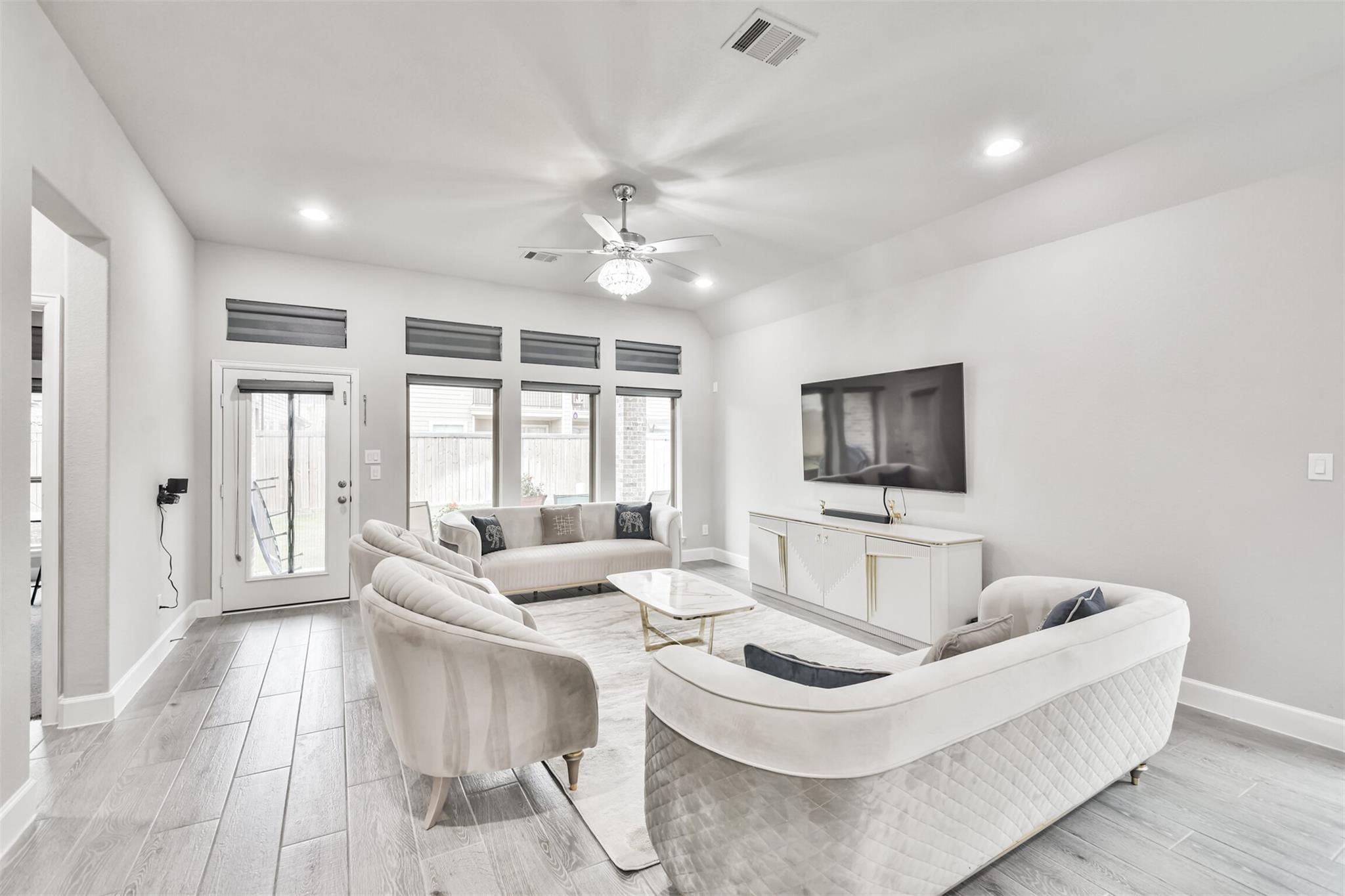 15018 Concho River Way Cypress, TX 77433 - Photo 16 of 34 a living room with furniture and a flat screen tv