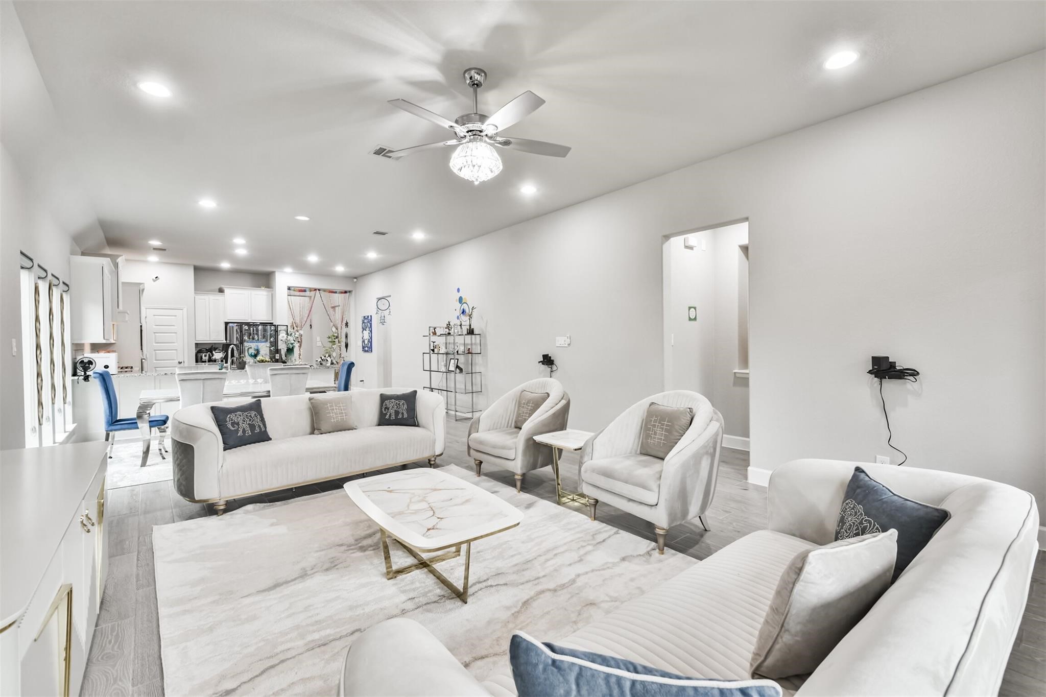 15018 Concho River Way Cypress, TX 77433 - Photo 17 of 34 a living room with furniture and kitchen view
