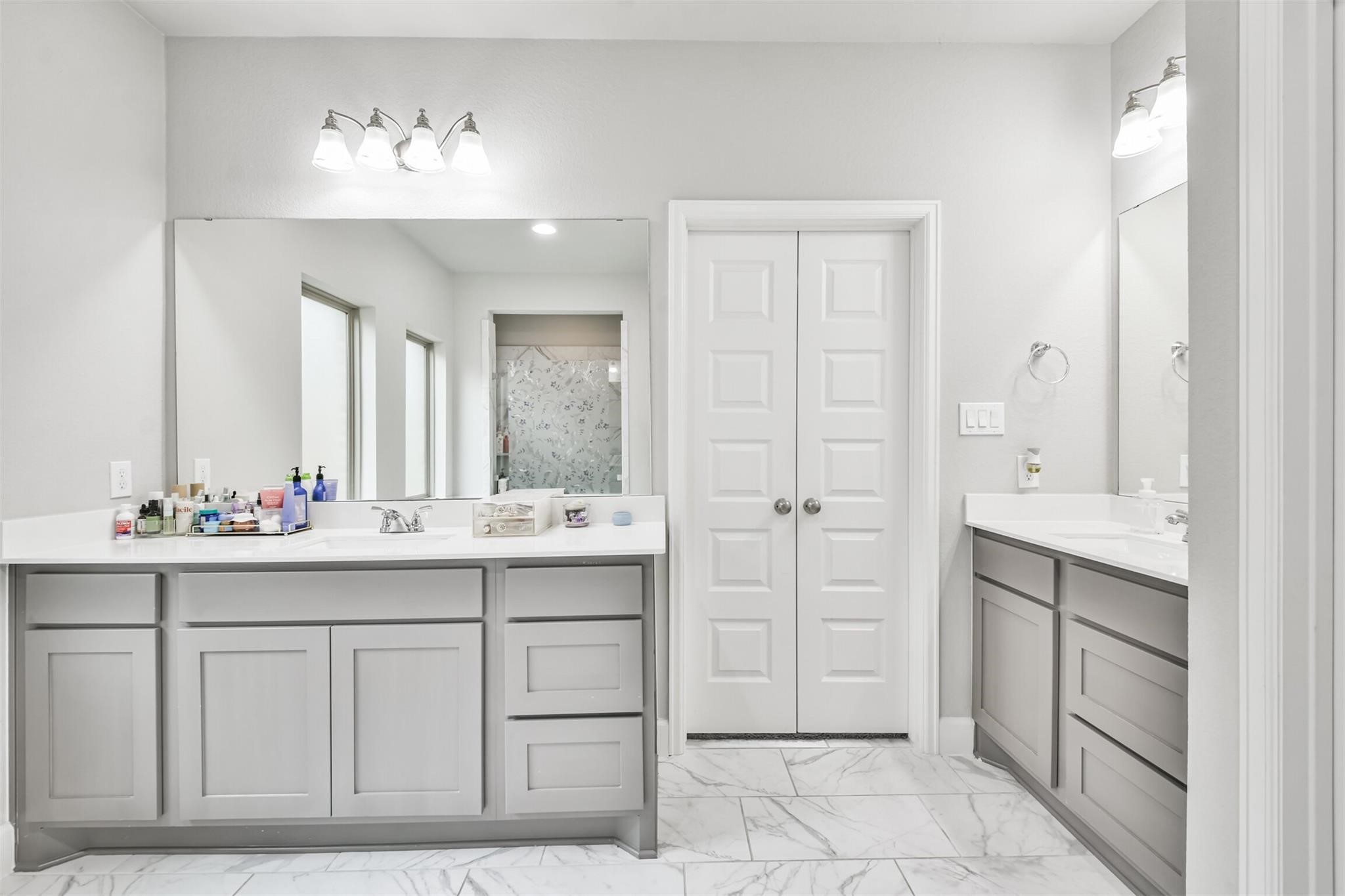 15018 Concho River Way Cypress, TX 77433 - Photo 19 of 34 a bathroom with a sink and a mirror