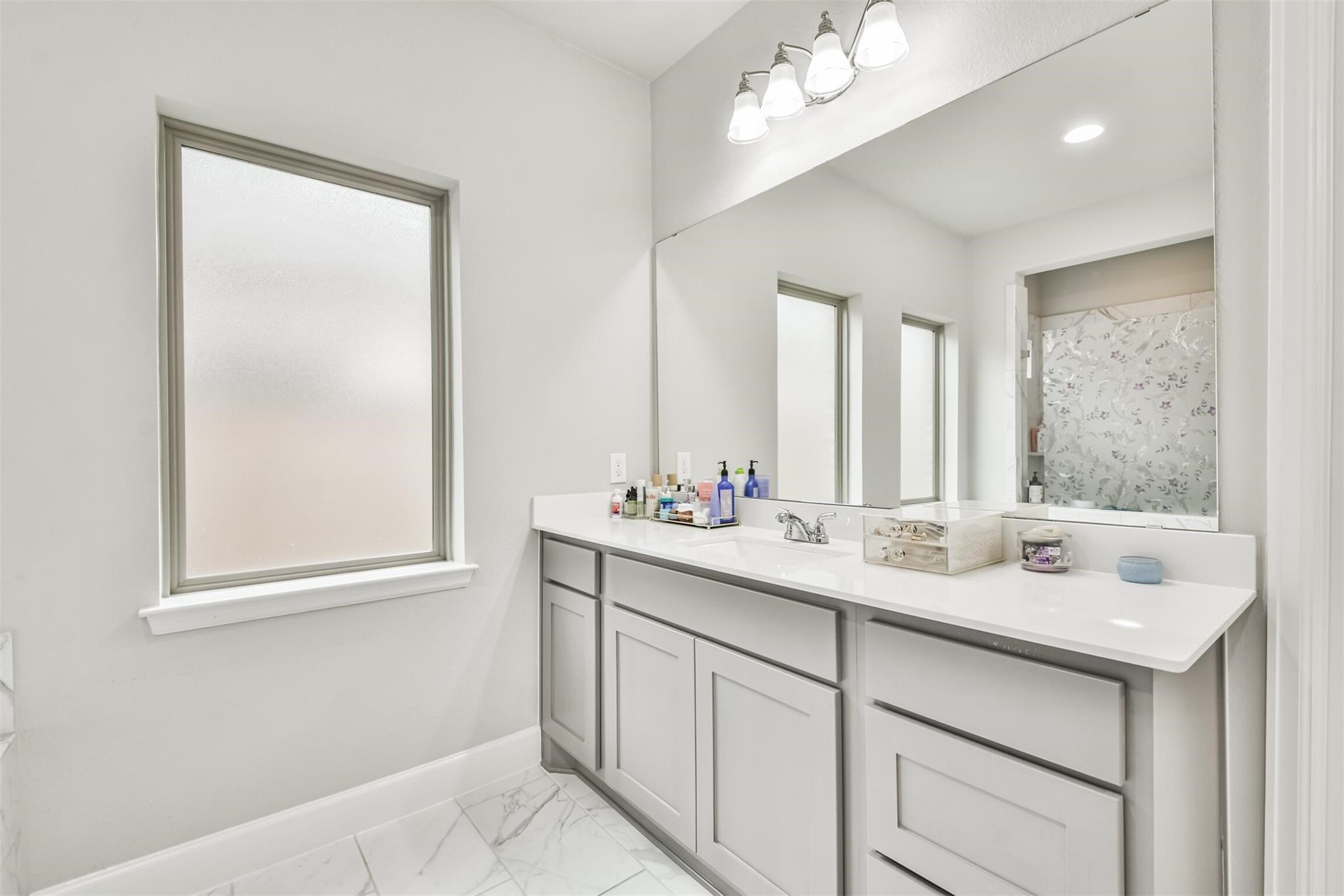 15018 Concho River Way Cypress, TX 77433 - Photo 20 of 34 a bathroom with a sink double vanity and a mirror
