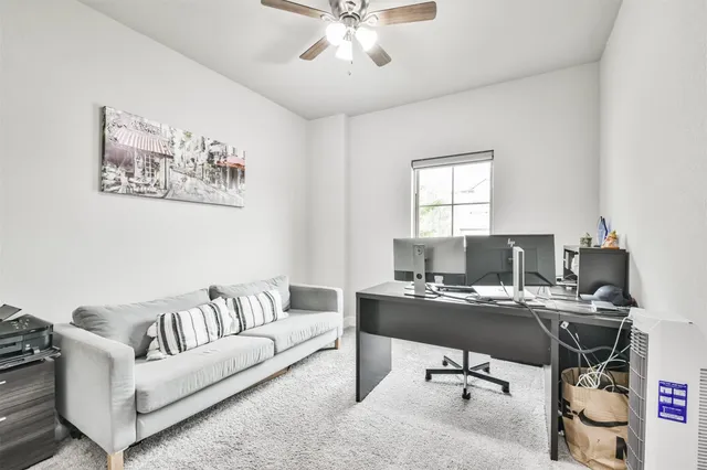 a work room with furniture and a window
