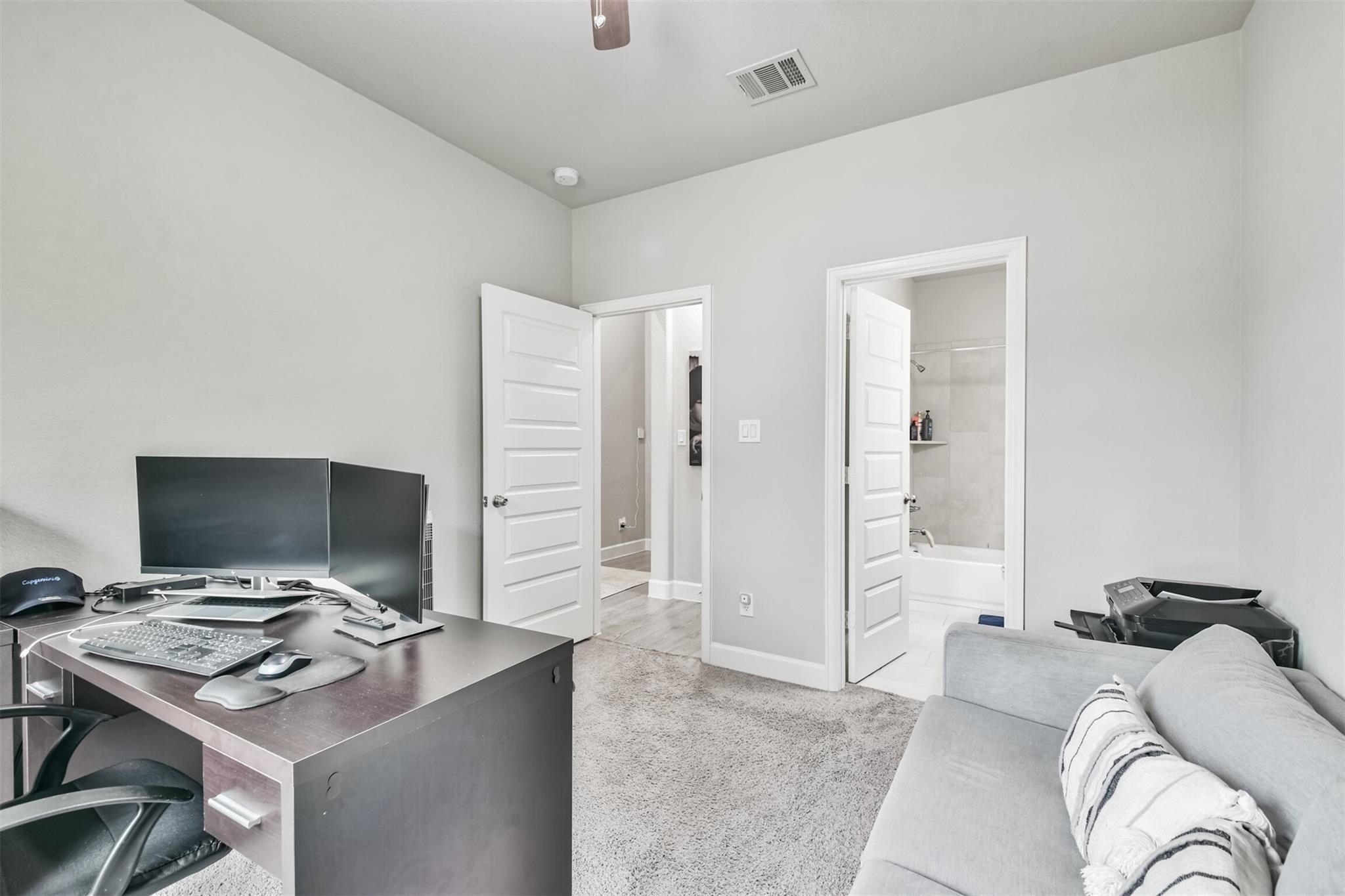 15018 Concho River Way Cypress, TX 77433 - Photo 24 of 34 a bedroom with a workspace