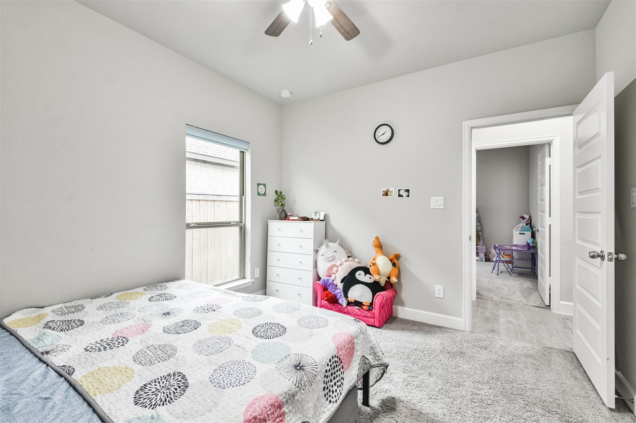 15018 Concho River Way Cypress, TX 77433 - Photo 28 of 34 a bedroom with a bed and a window