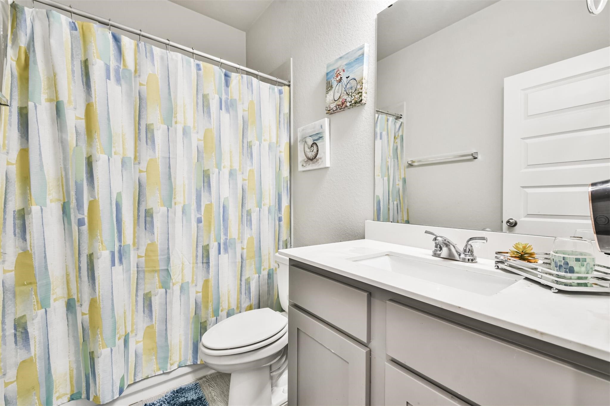 15018 Concho River Way Cypress, TX 77433 - Photo 29 of 34 a bathroom with a sink and a mirror