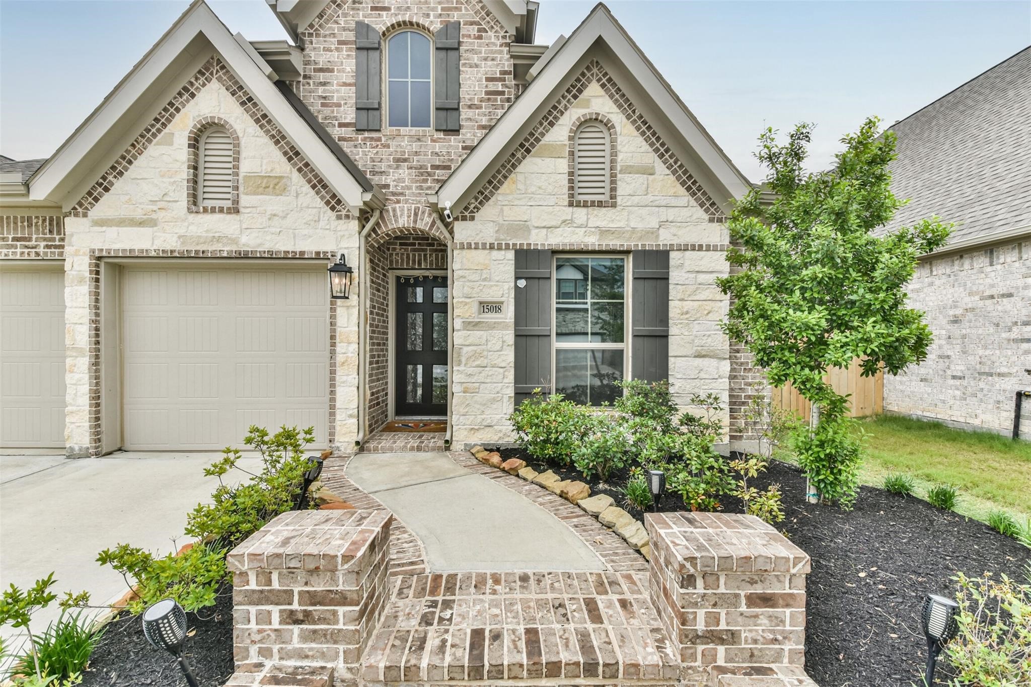 15018 Concho River Way Cypress, TX 77433 - Photo 3 of 34 a front view of a house with a yard