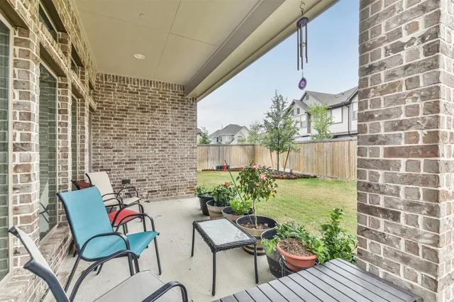 a view of a house with backyard and porch