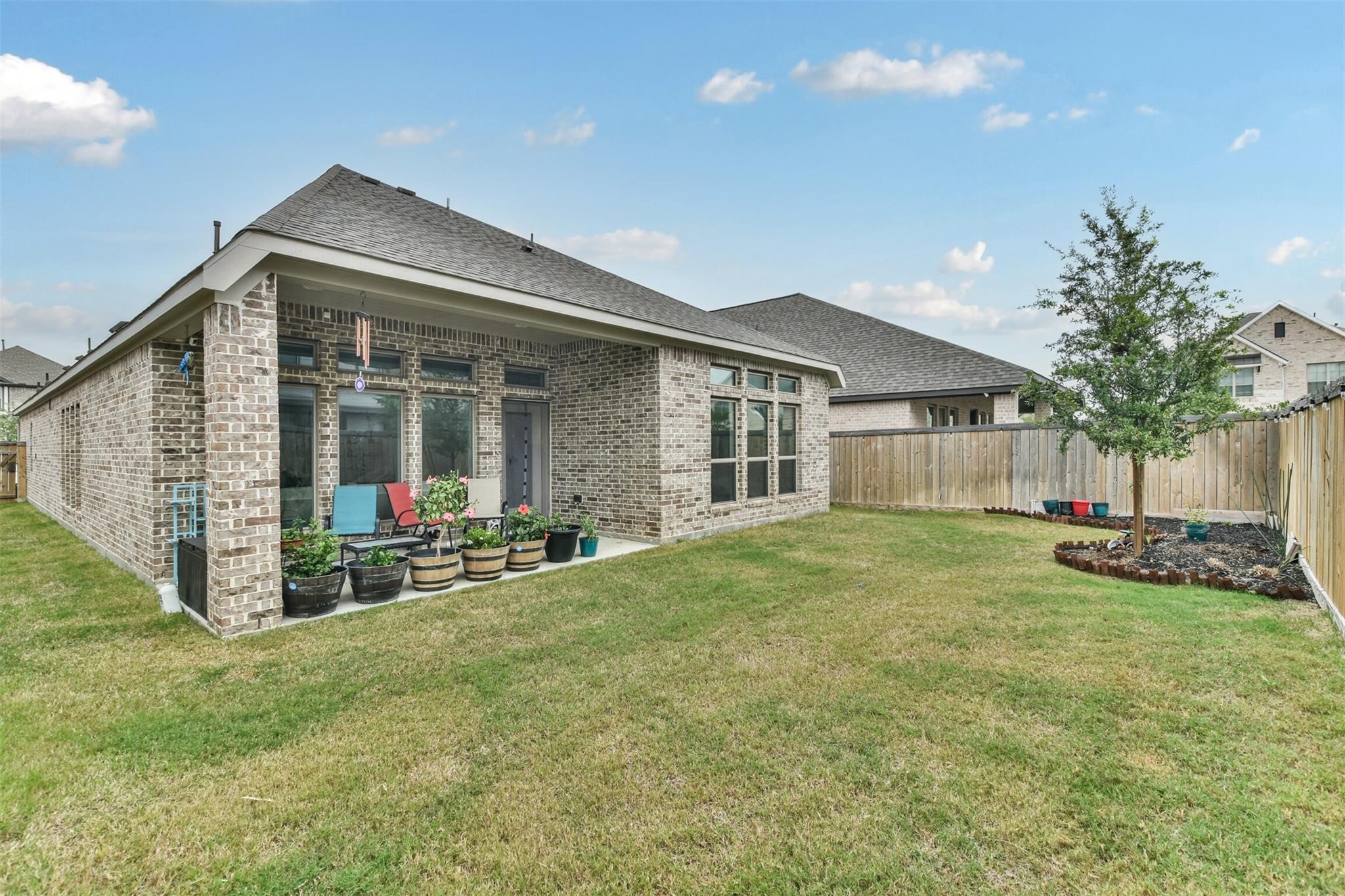 15018 Concho River Way Cypress, TX 77433 - Photo 33 of 34 a view of a house with backyard and porch