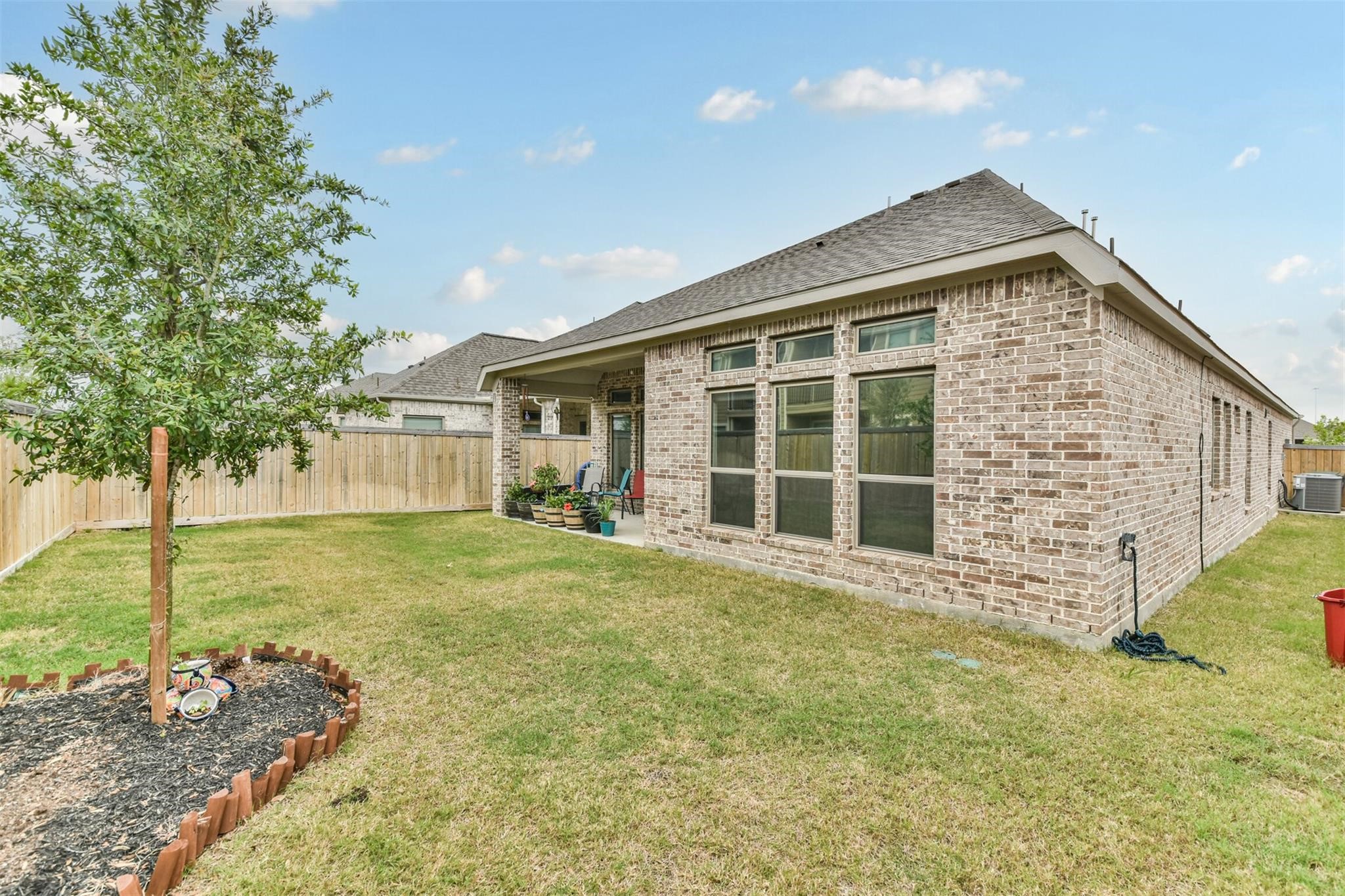 15018 Concho River Way Cypress, TX 77433 - Photo 34 of 34 a front view of a house with a garden