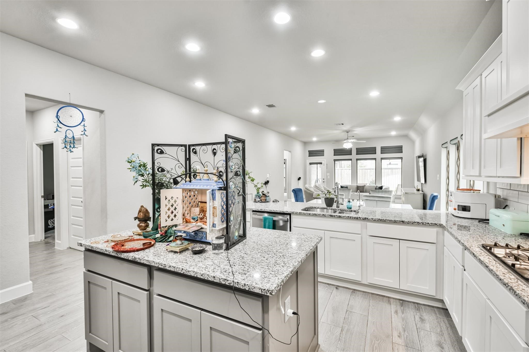 15018 Concho River Way Cypress, TX 77433 - Photo 9 of 34 a kitchen with lots of counter top space sink and stainless steel appliances