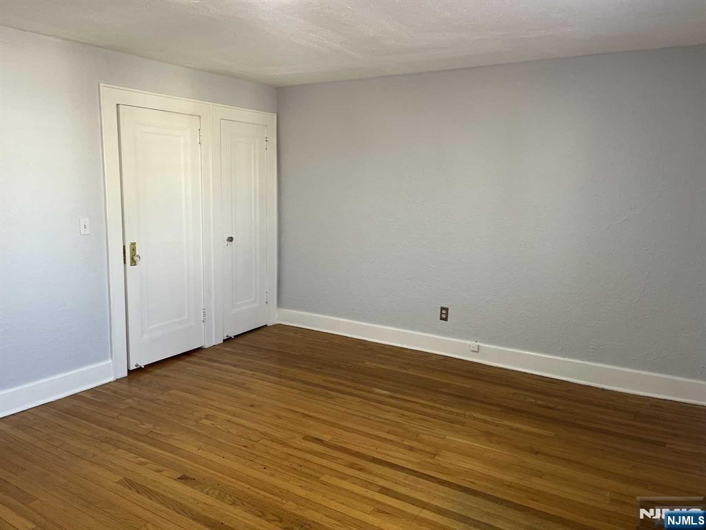 212 Walton Street, Unit 2 Ridgewood, NJ 07450 - Photo 19 of 27 a view of an empty room and wooden floor