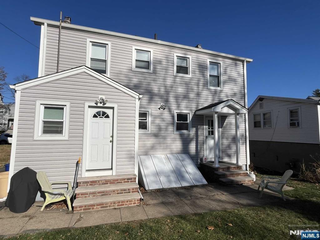 212 Walton Street, Unit 2 Ridgewood, NJ 07450 - Photo 26 of 27 a front view of a house with a yard