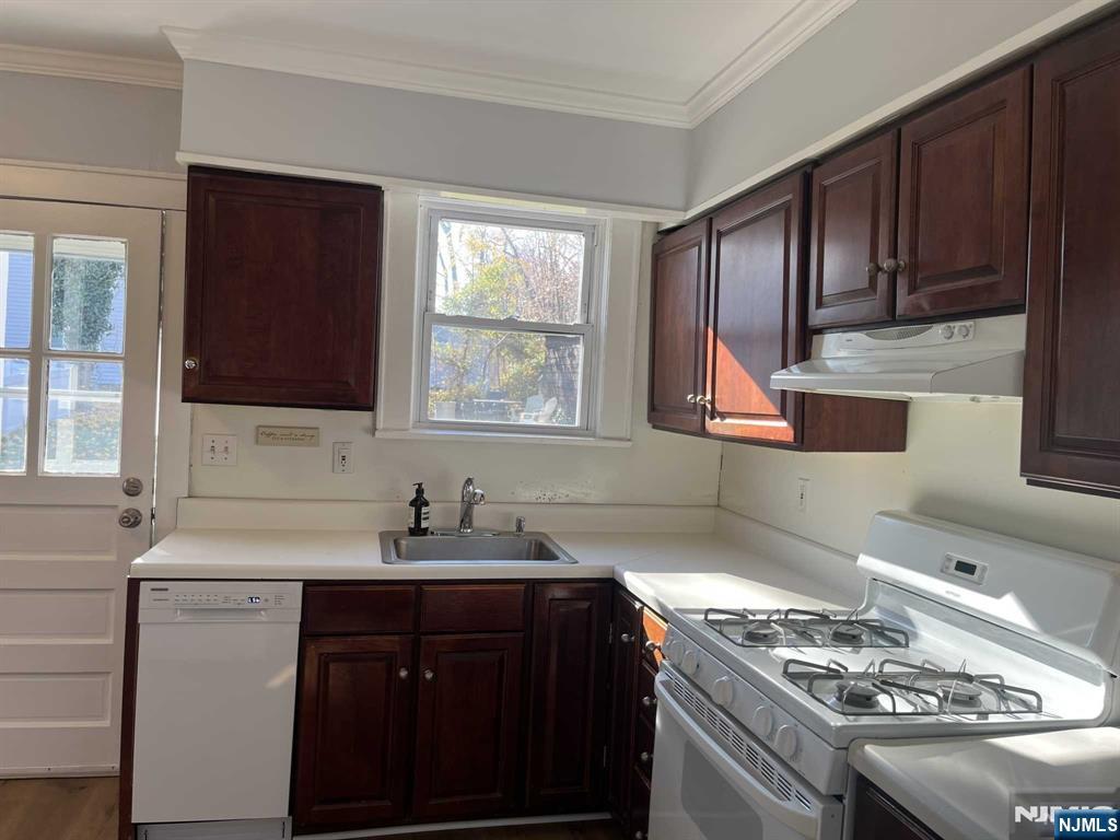 212 Walton Street, Unit 2 Ridgewood, NJ 07450 - Photo 4 of 27 a kitchen with a sink stove top oven and cabinets