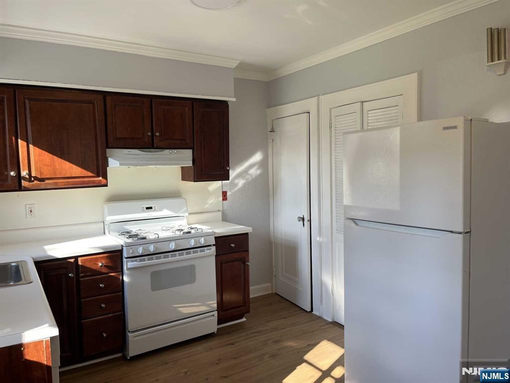 212 Walton Street, Unit 2 Ridgewood, NJ 07450 - Photo 5 of 27 a kitchen with a stove top oven and refrigerator