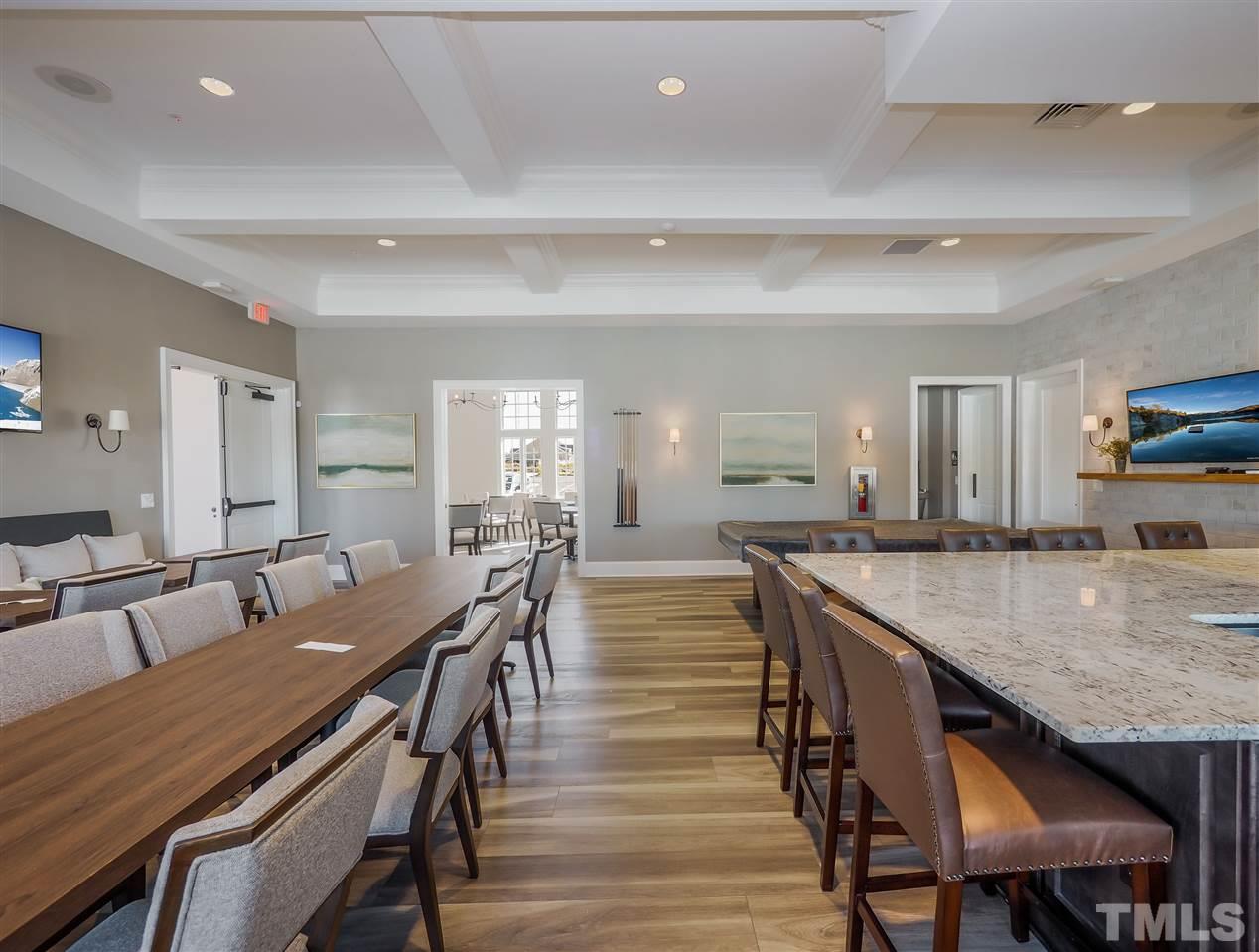 250 Mahogany Run, Unit 191 Raleigh, NC 27610 - Photo 14 of 29 a view of a dining room with furniture and wooden floor