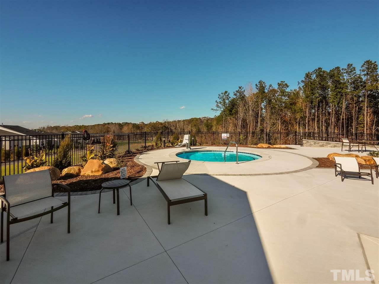250 Mahogany Run, Unit 191 Raleigh, NC 27610 - Photo 20 of 29 a view of swimming pool with outdoor seating and trees in the background
