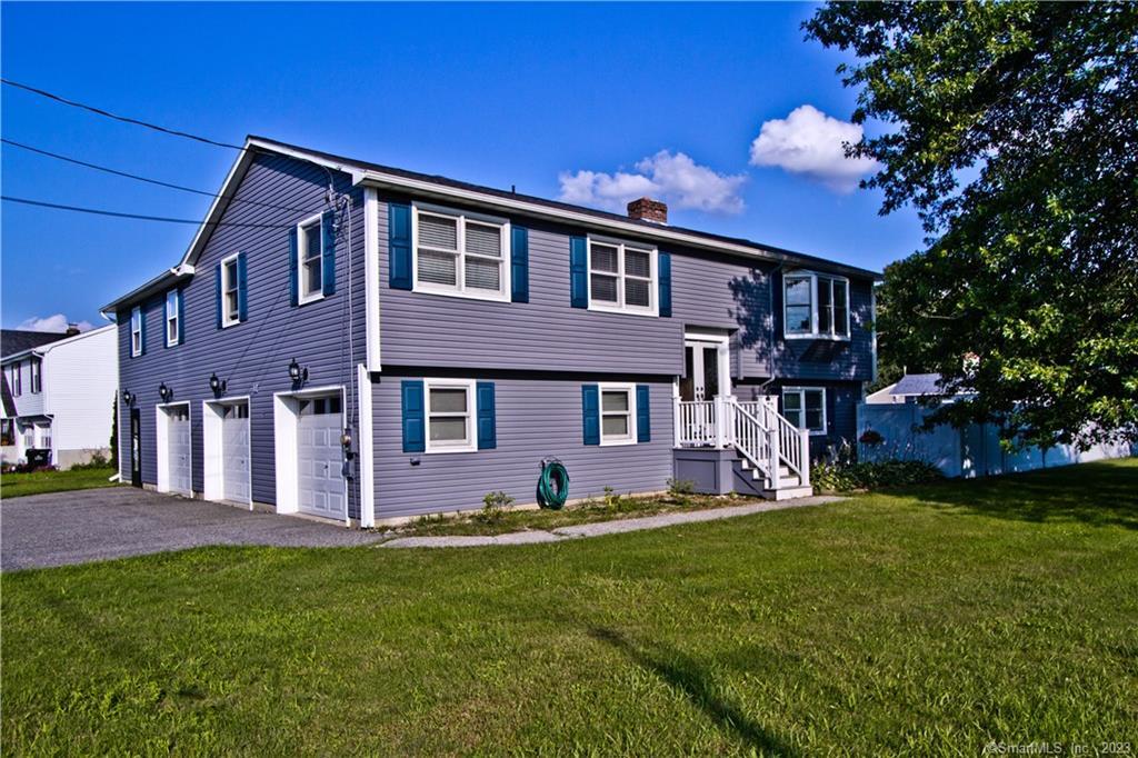 13 Porter Plain Road Thompson, CT 06277 - Photo 1 of 1 a front view of a house with a yard