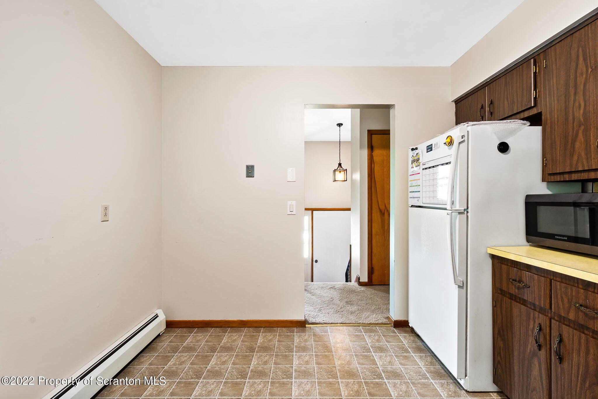 199 Spring Hill Road Moscow, PA 18444 - Photo 13 of 33 a view of a kitchen with a refrigerator and microwave