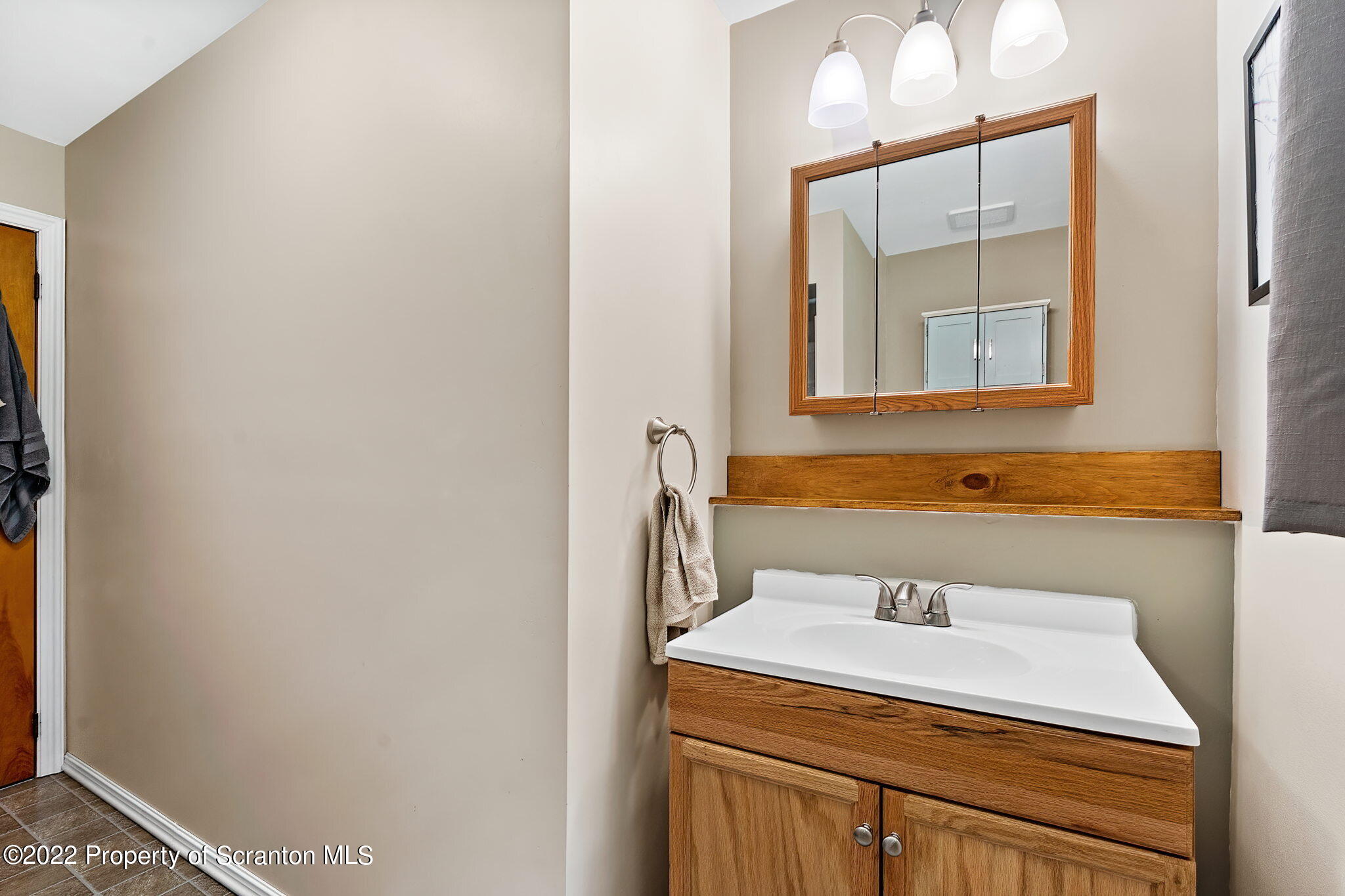199 Spring Hill Road Moscow, PA 18444 - Photo 15 of 33 a bathroom with a sink and a mirror