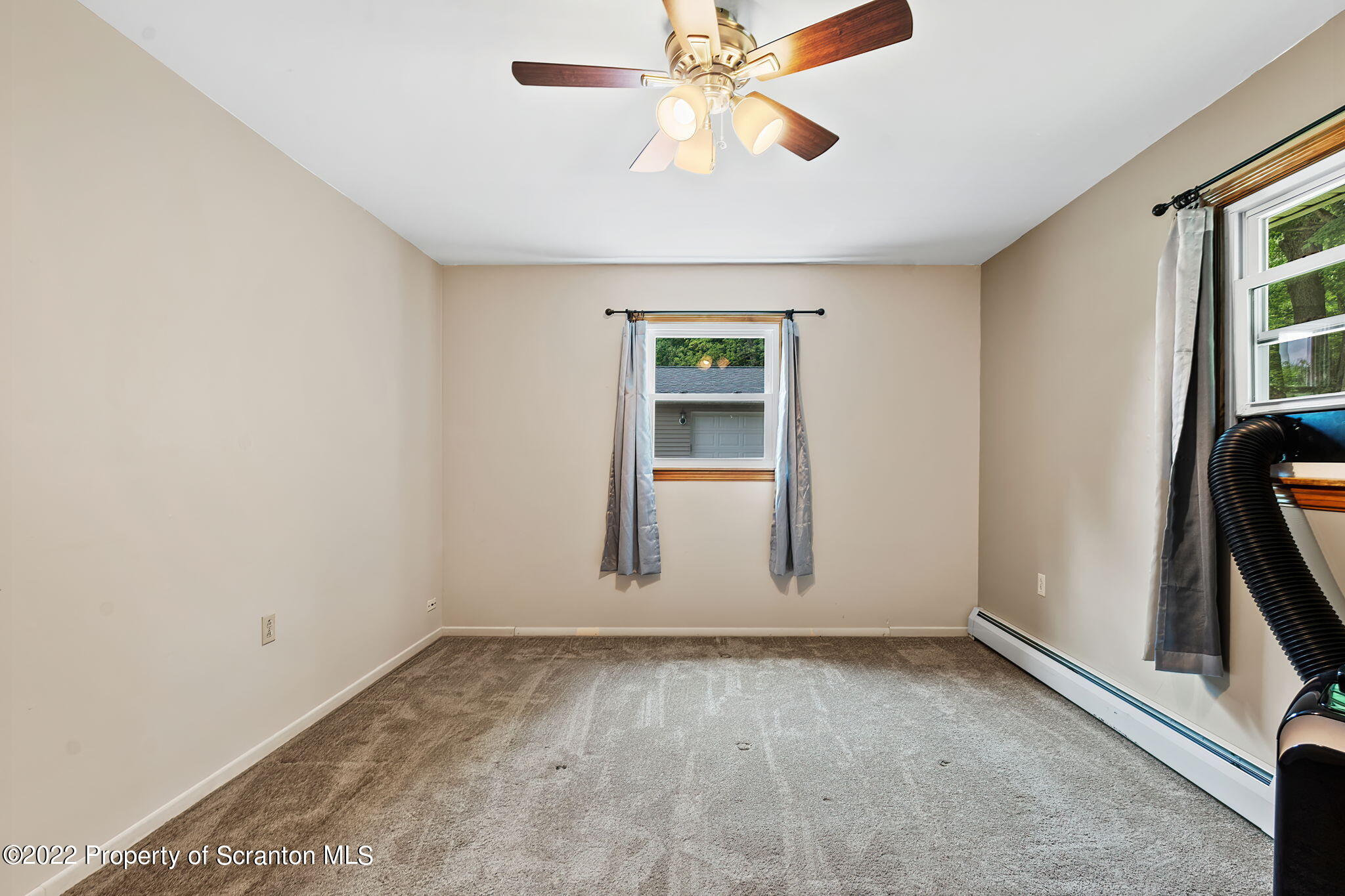 199 Spring Hill Road Moscow, PA 18444 - Photo 17 of 33 an empty room with windows and fan