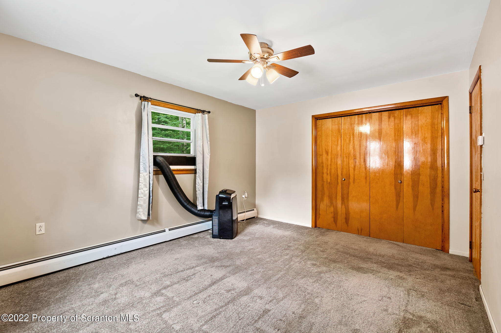 199 Spring Hill Road Moscow, PA 18444 - Photo 18 of 33 an empty room with windows and closet