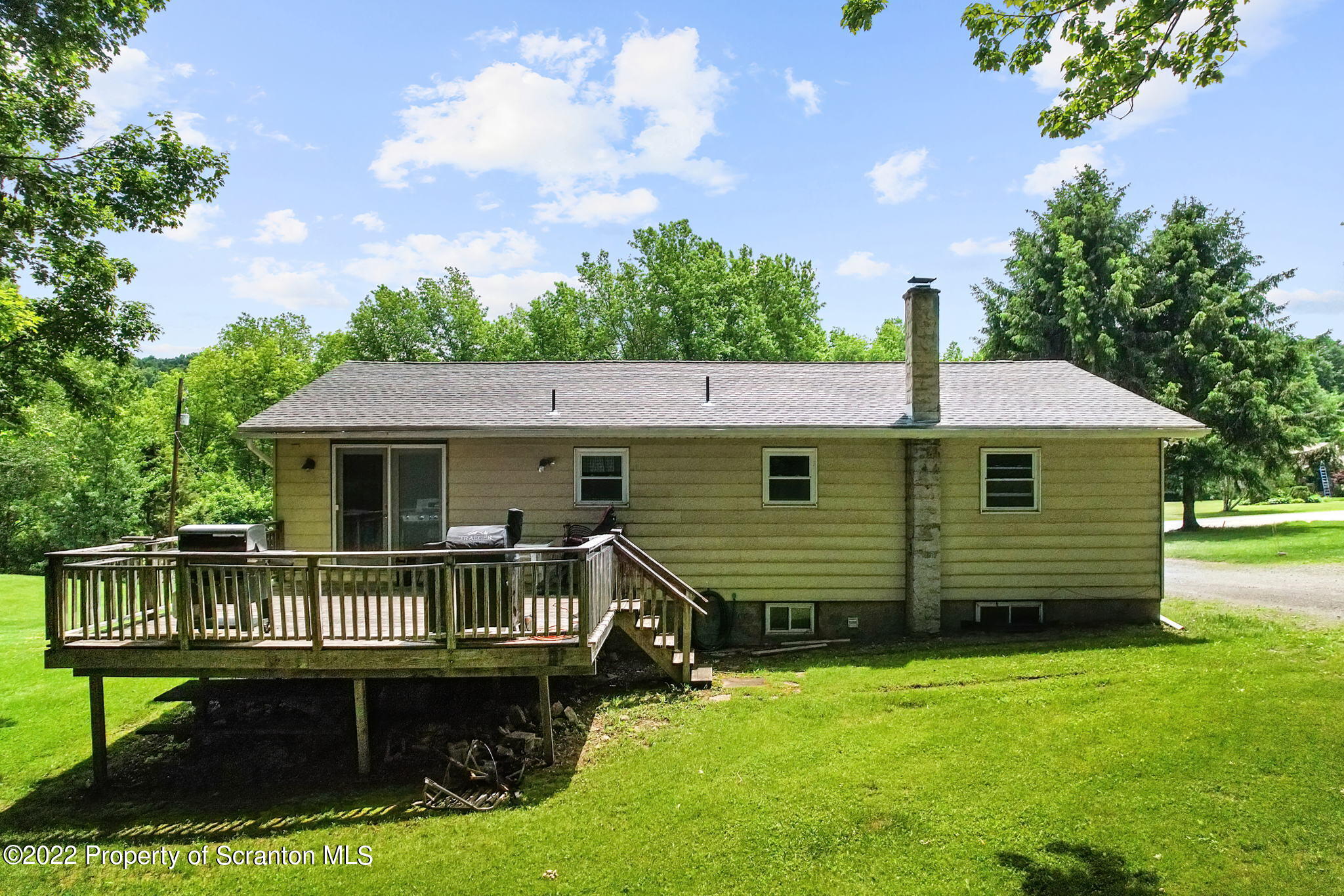 199 Spring Hill Road Moscow, PA 18444 - Photo 25 of 33 a front view of a house with a yard