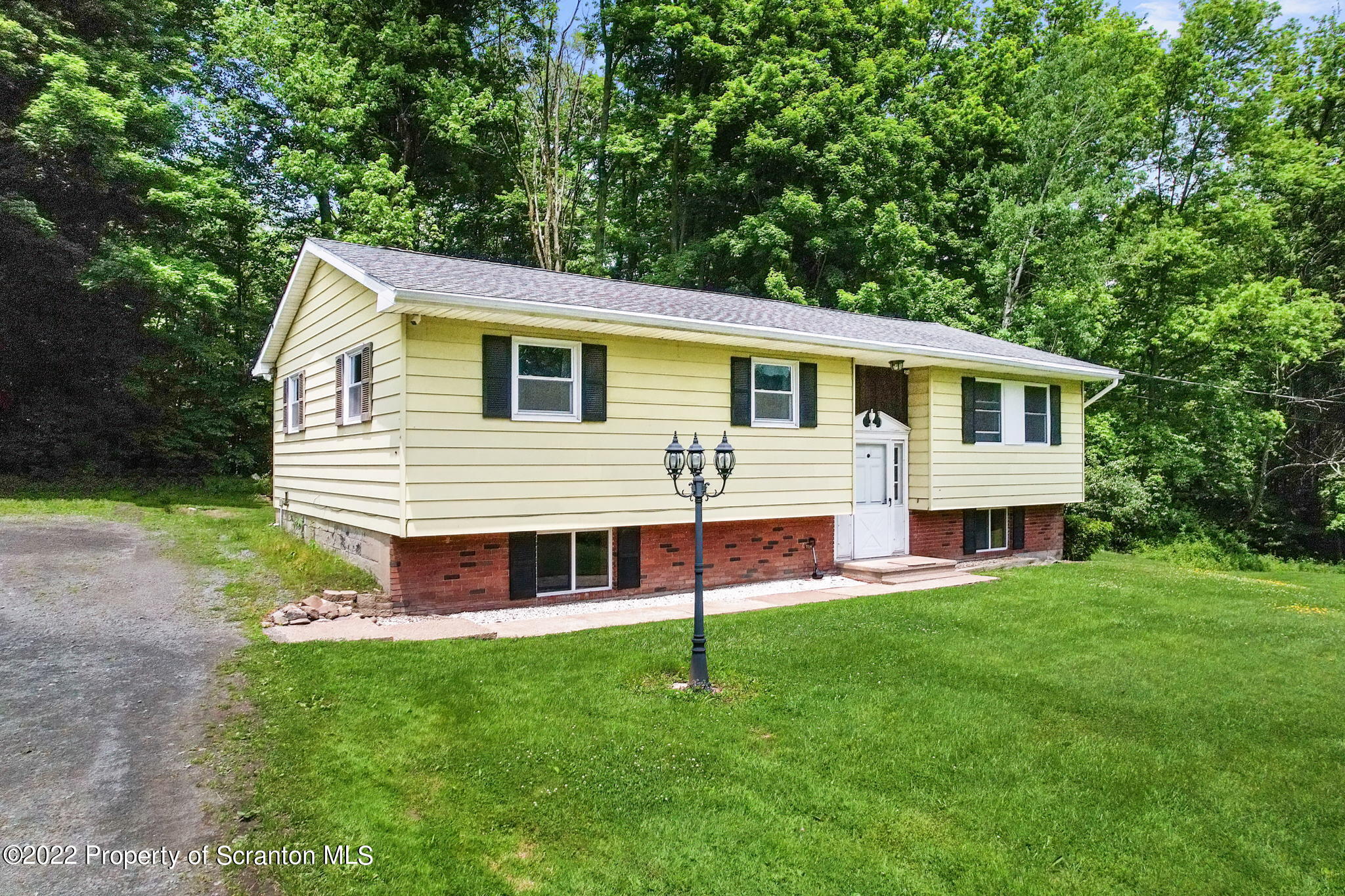 199 Spring Hill Road Moscow, PA 18444 - Photo 3 of 33 a view of a house with a backyard