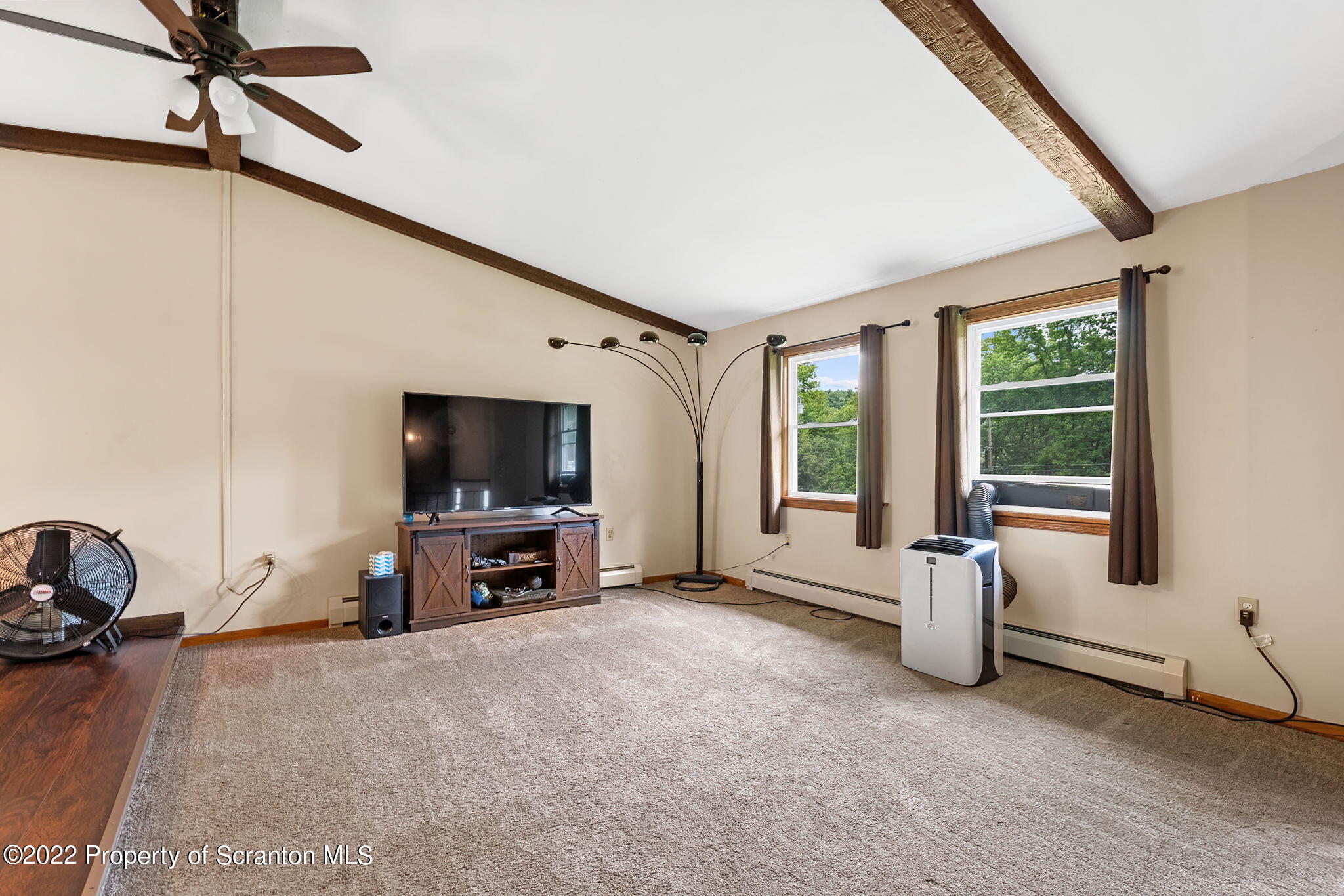 199 Spring Hill Road Moscow, PA 18444 - Photo 4 of 33 a view of a livingroom with furniture and a flat screen tv