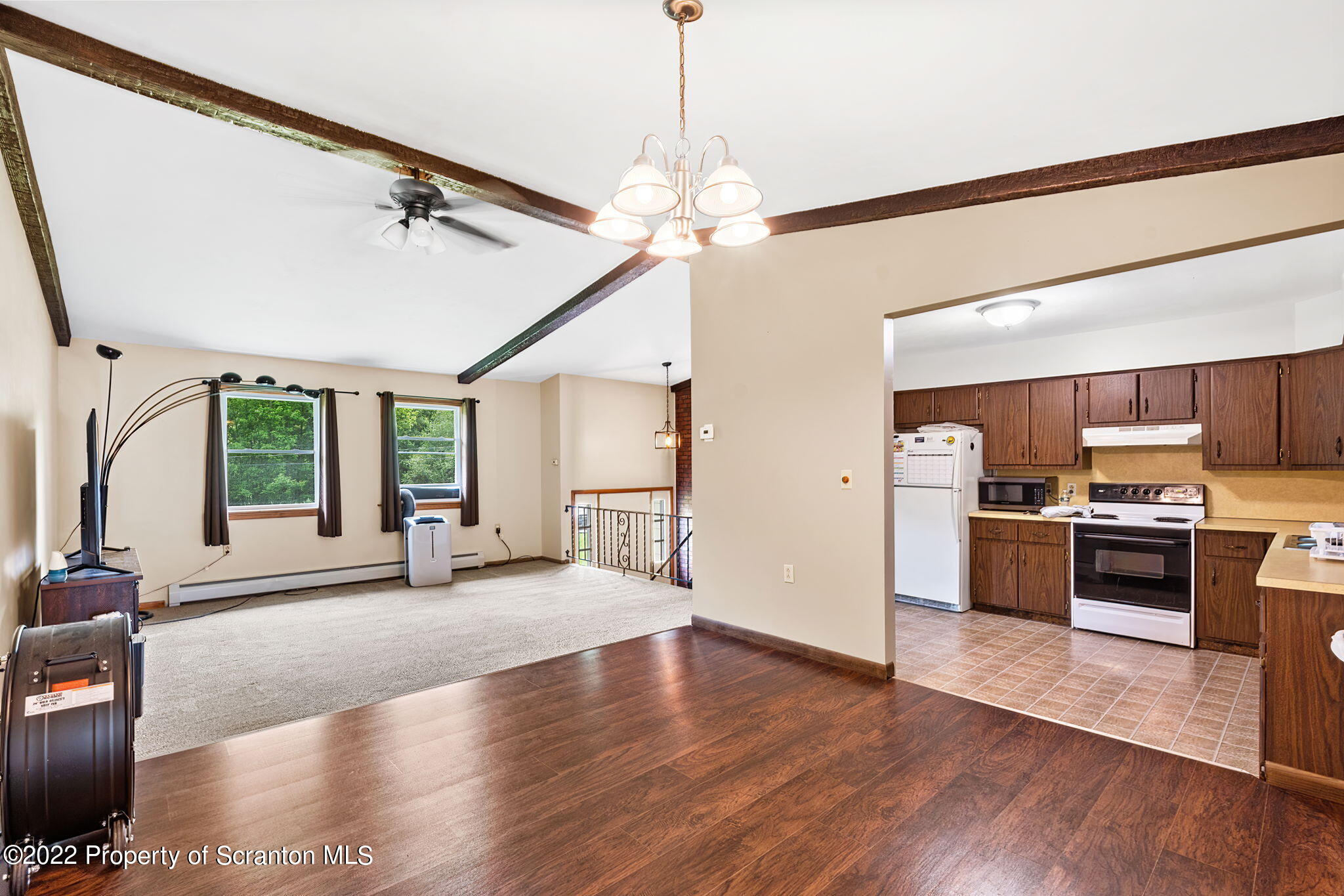 199 Spring Hill Road Moscow, PA 18444 - Photo 7 of 33 a view of a kitchen with a stove cabinets and wooden floor