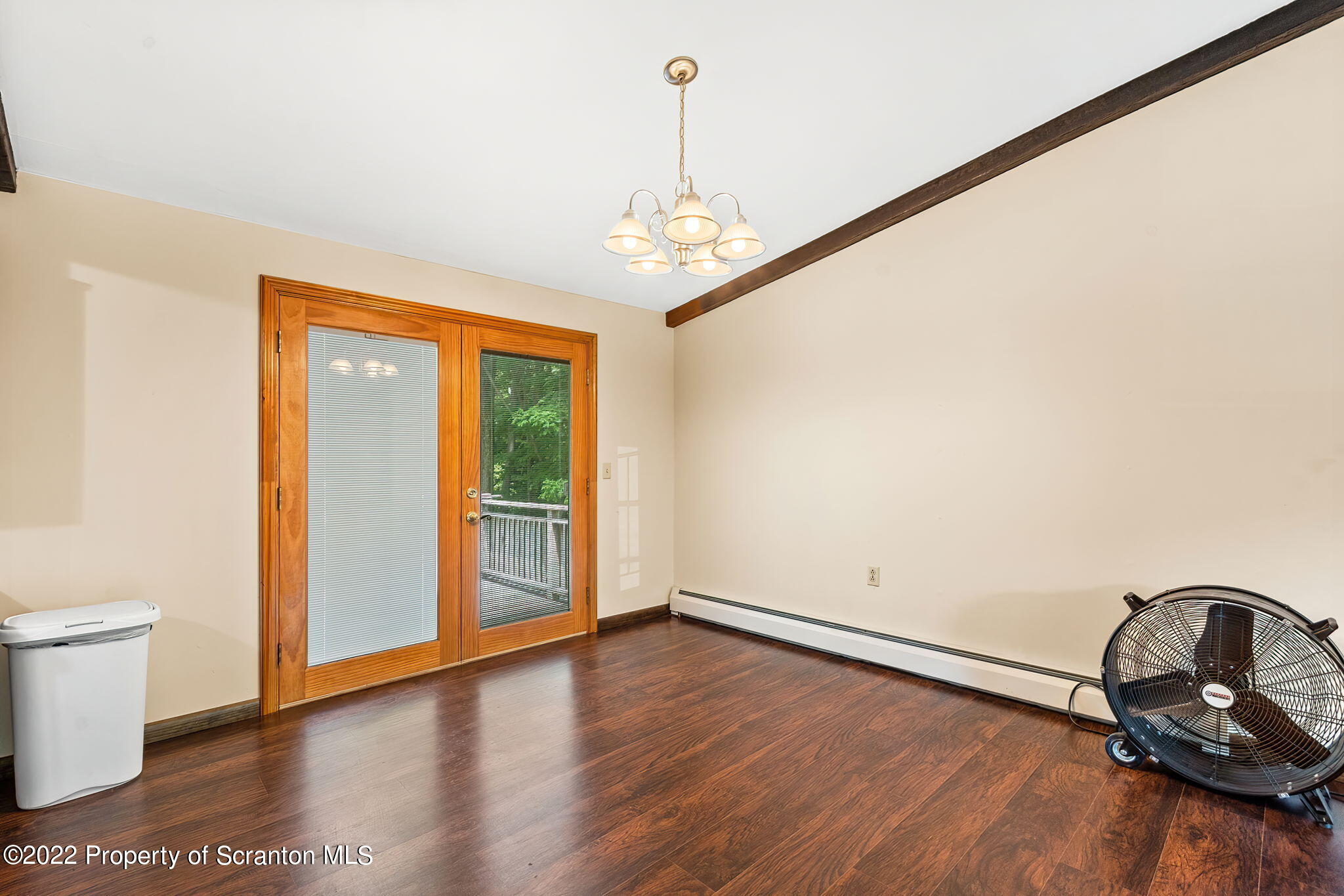 199 Spring Hill Road Moscow, PA 18444 - Photo 8 of 33 a view of a room with wooden floor and windows