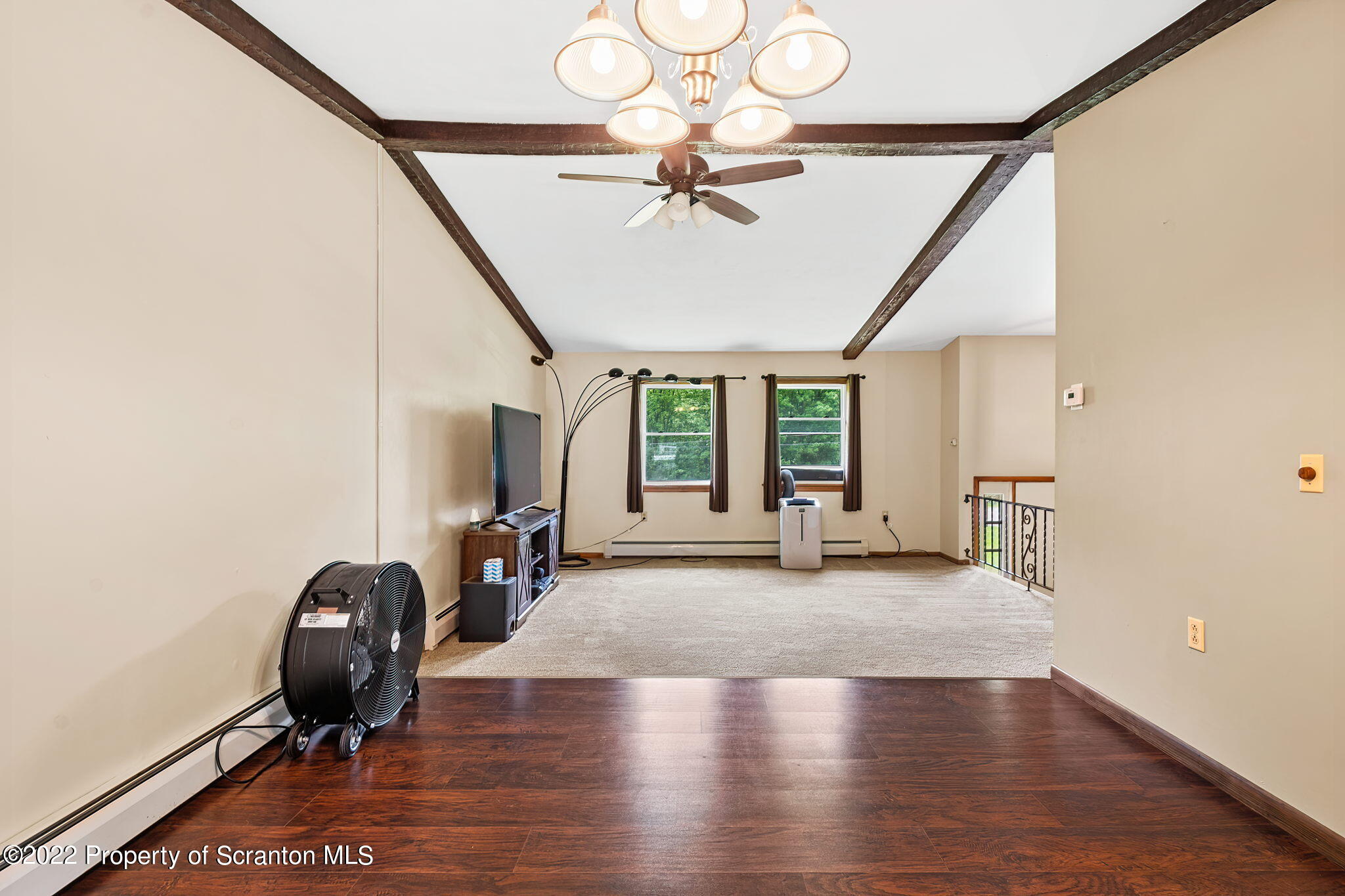 199 Spring Hill Road Moscow, PA 18444 - Photo 10 of 33 a view of a livingroom with furniture staircase and a ceiling fan